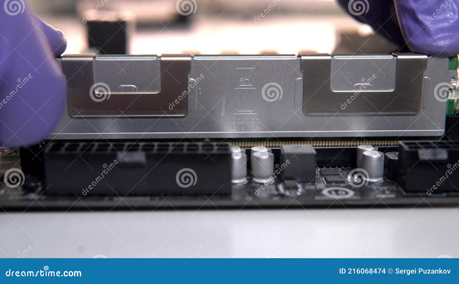The Repair Technician Inserts a RAM Stick into the Socket on the