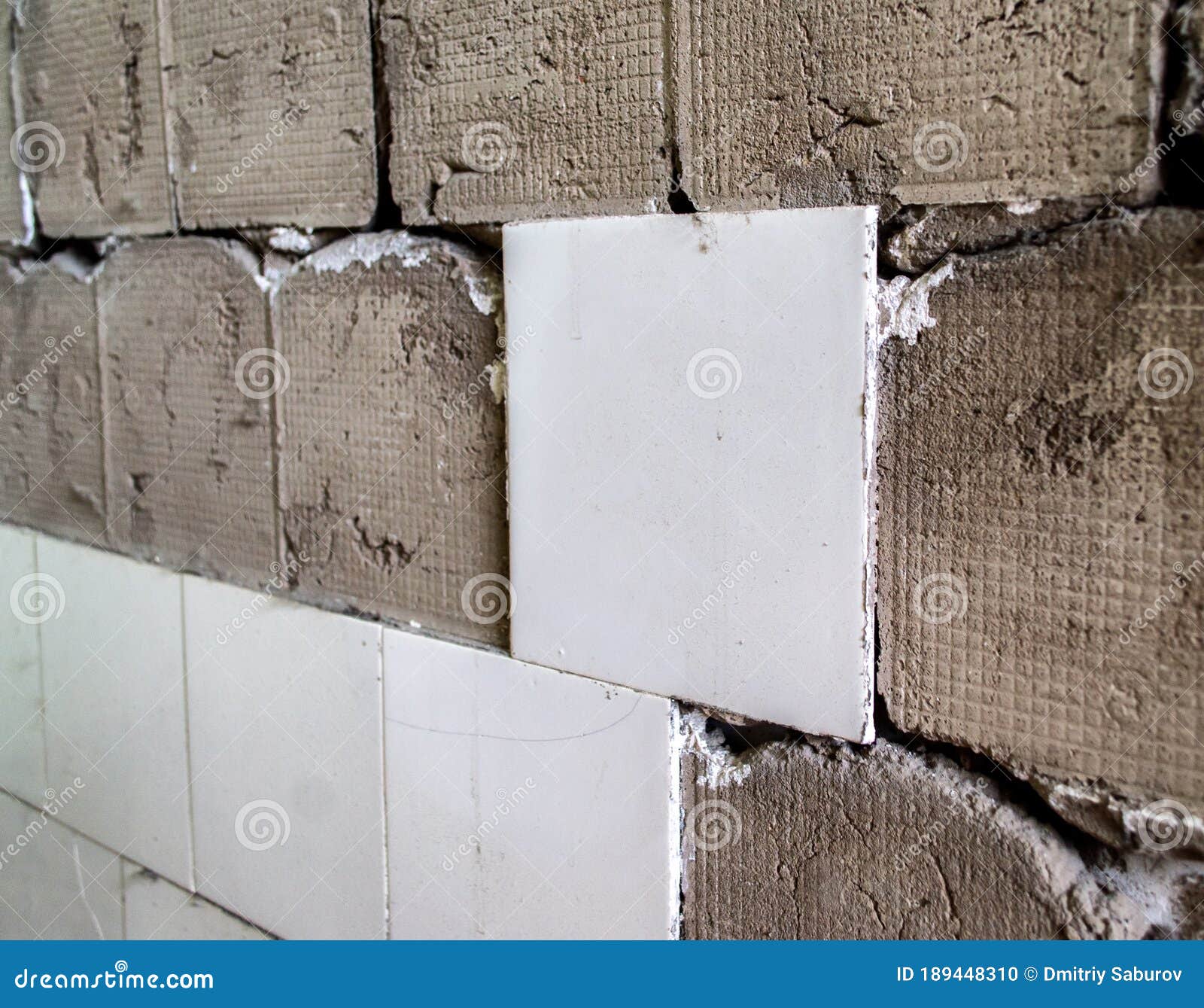 Repair of Wall Tiles. Partially Knocked Down Tile Stock Photo Image