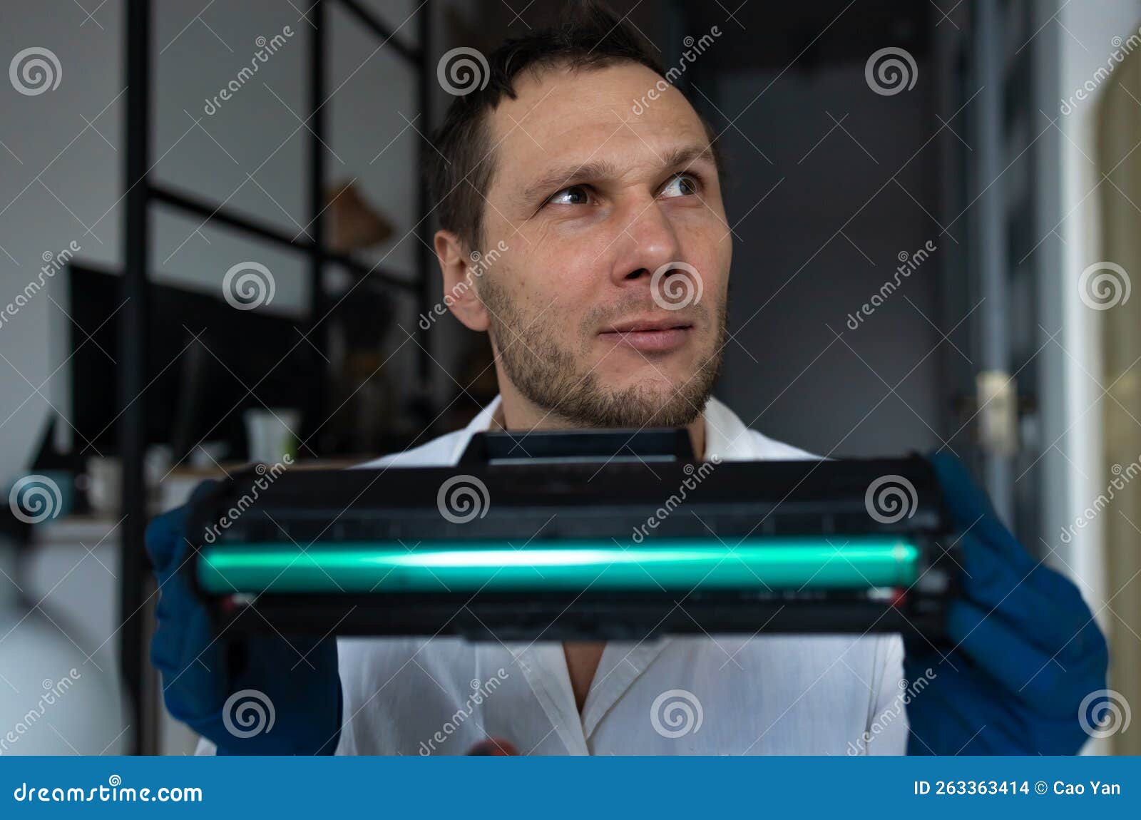 Hands Repairing Laser Toner Cartridge. Worker Laser Printer on a