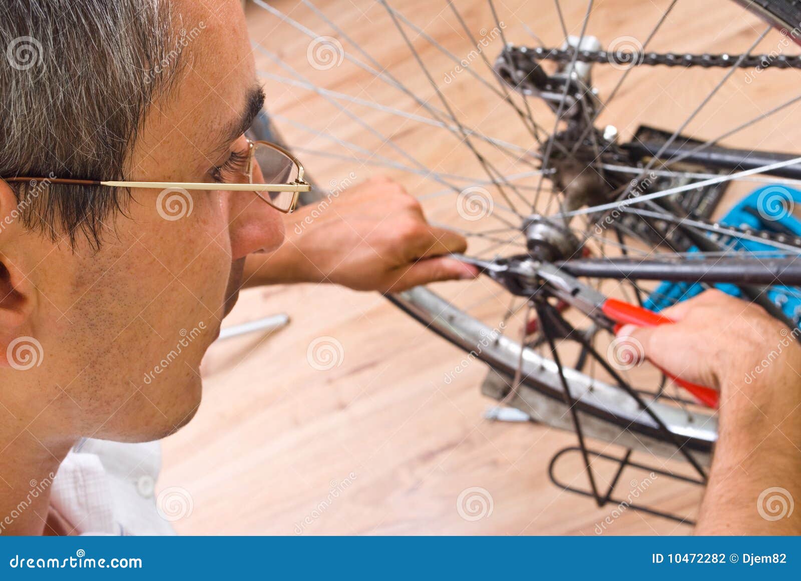 Repairing bike stock photo. Image of repair, minor, serviceman 10472282