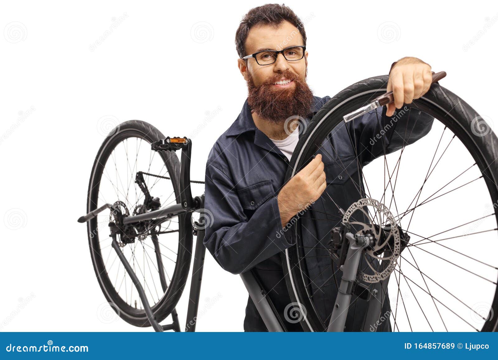 Repairman fixing a bicycle stock image. Image of equipment 164857689