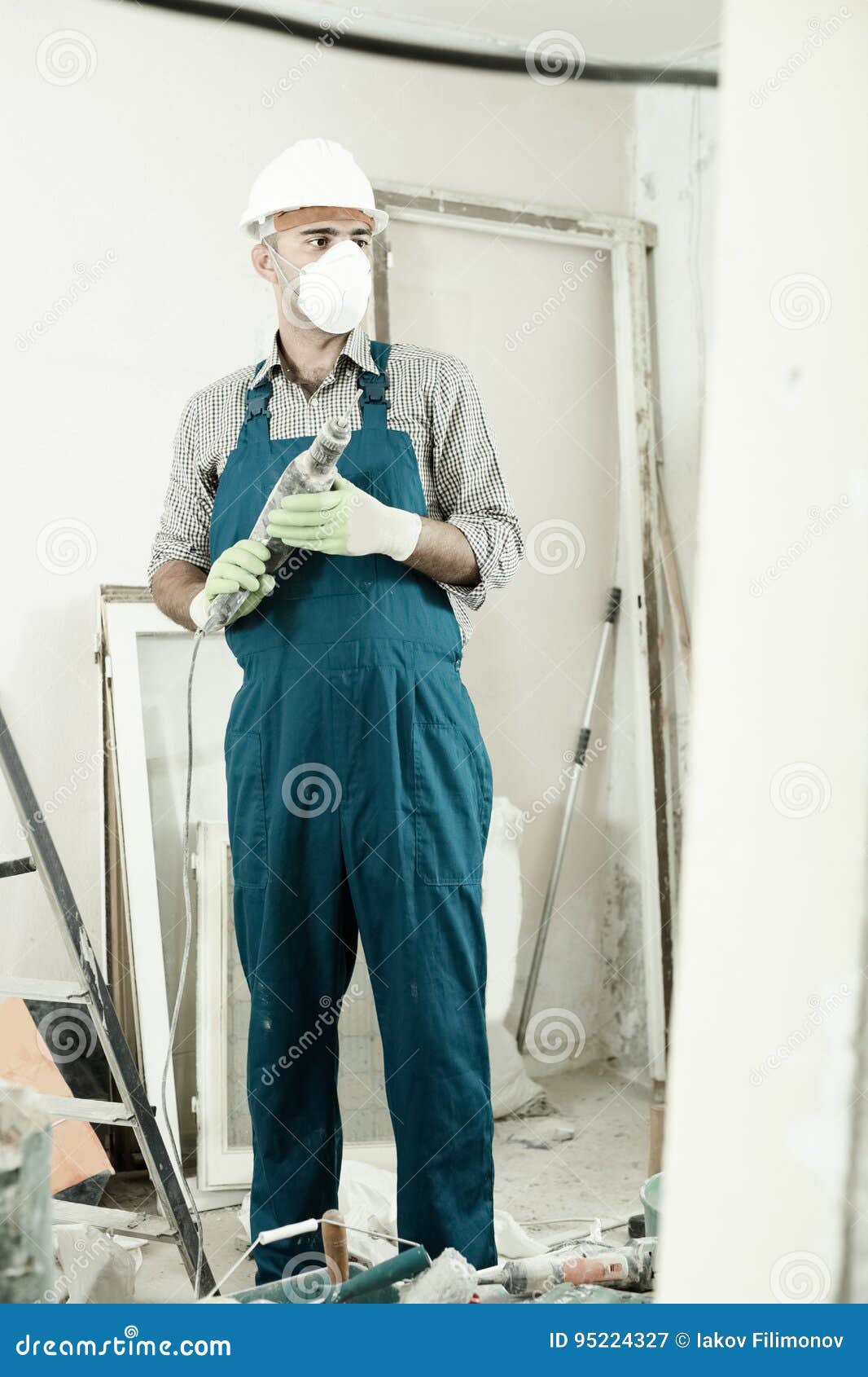 Repairman in Helmet is Perforating Wall with Drill Stock Image Image