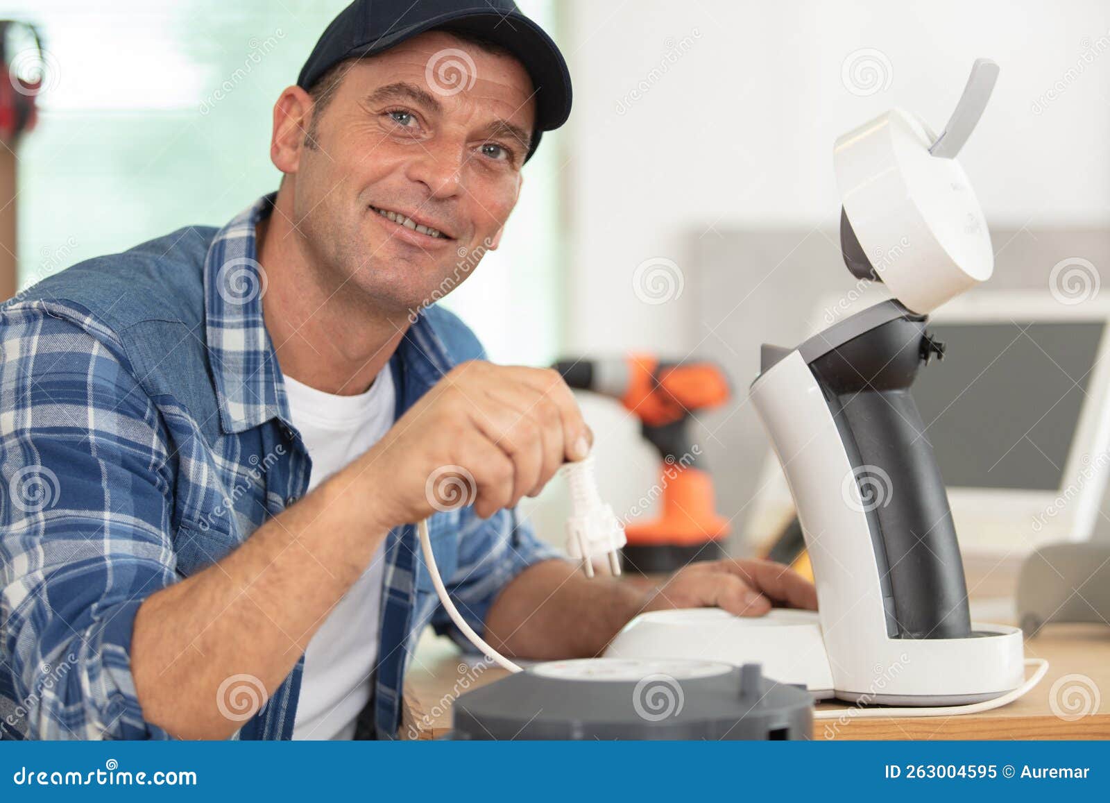 Repairman Plugging in Coffee Machine To Test it Stock Image Image of