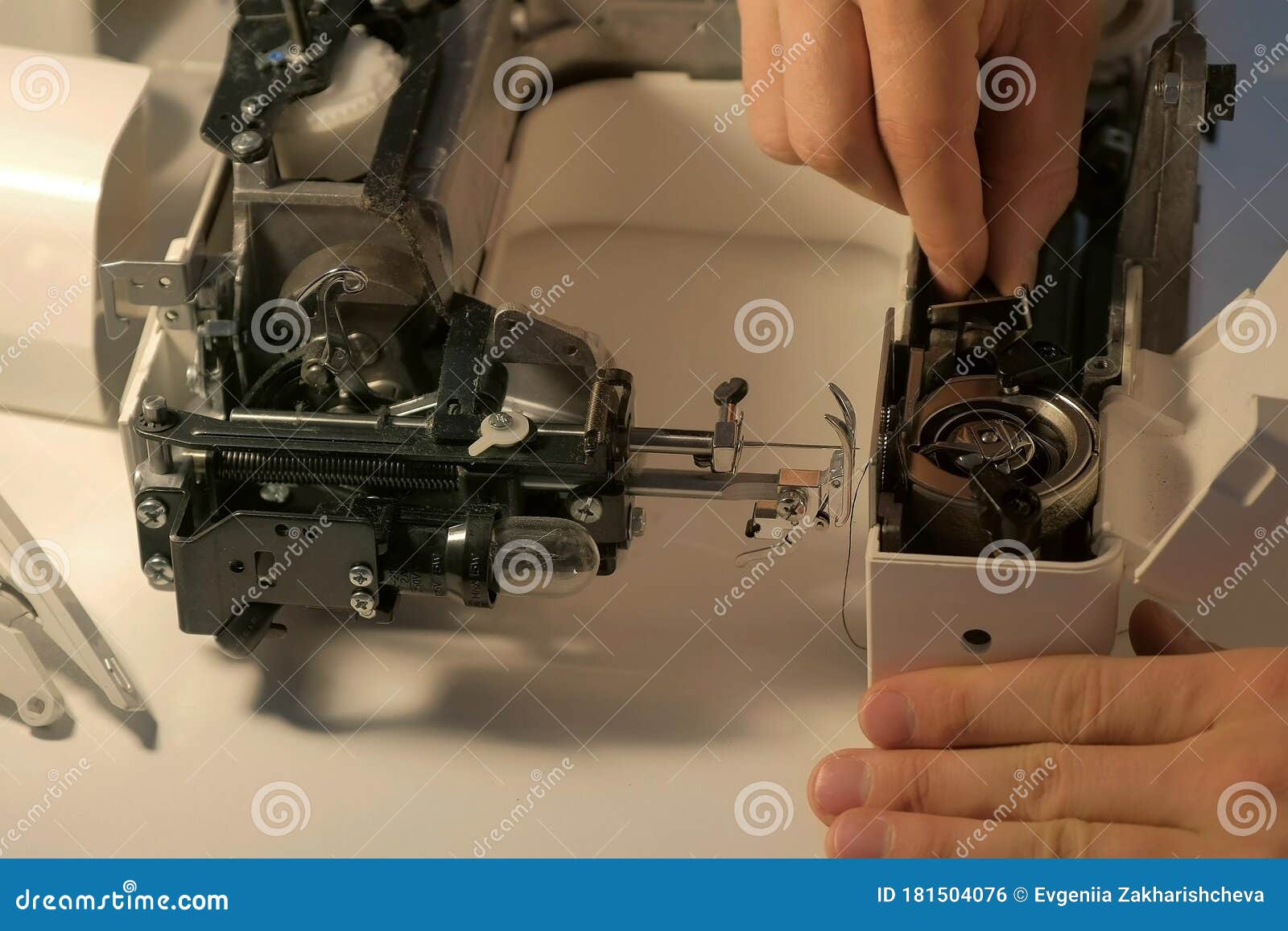 Repairman Testing Disassembles Sewing Machine in Repairing it