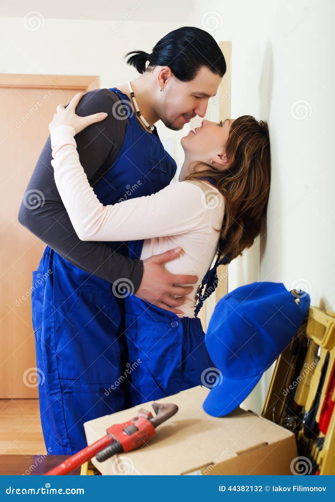 Repairman and Woman Flirting Stock Photo