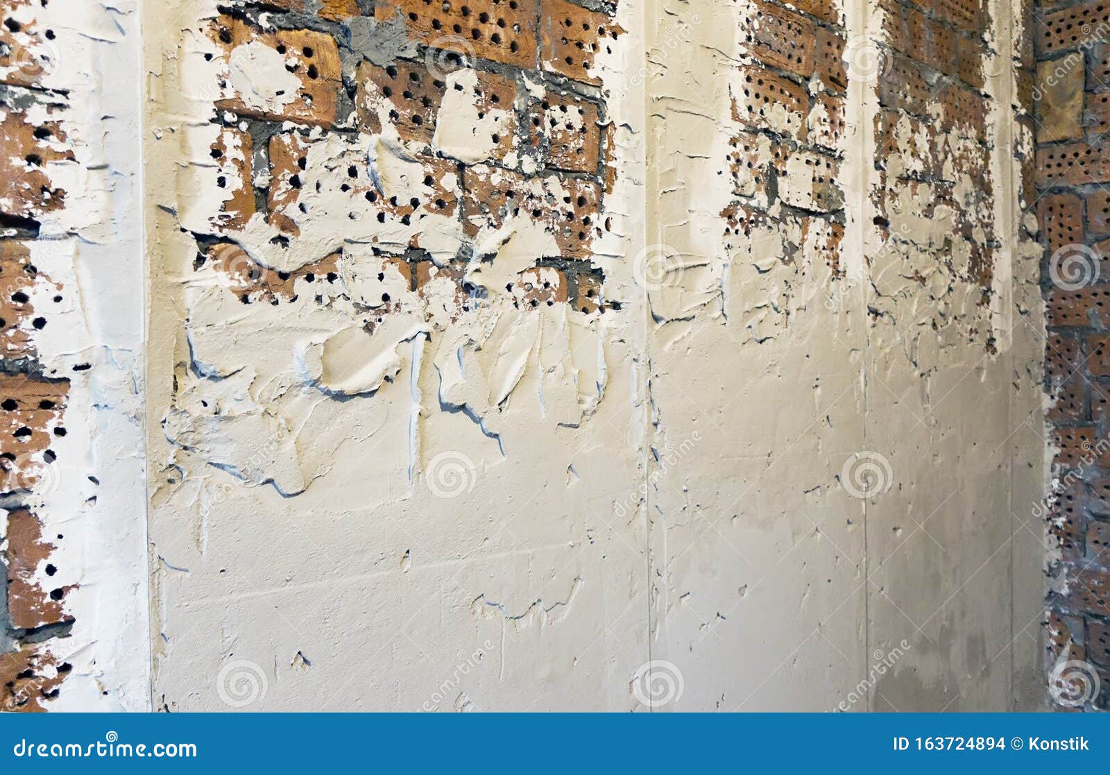 Repairs. Brick Wall with Mortar Guide Strip, Partially Applied Plaster