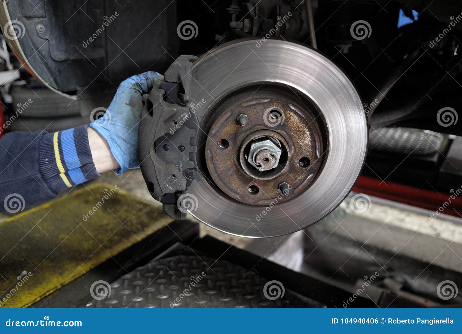Replacement of disc brakes stock photo. Image of auto 104940406