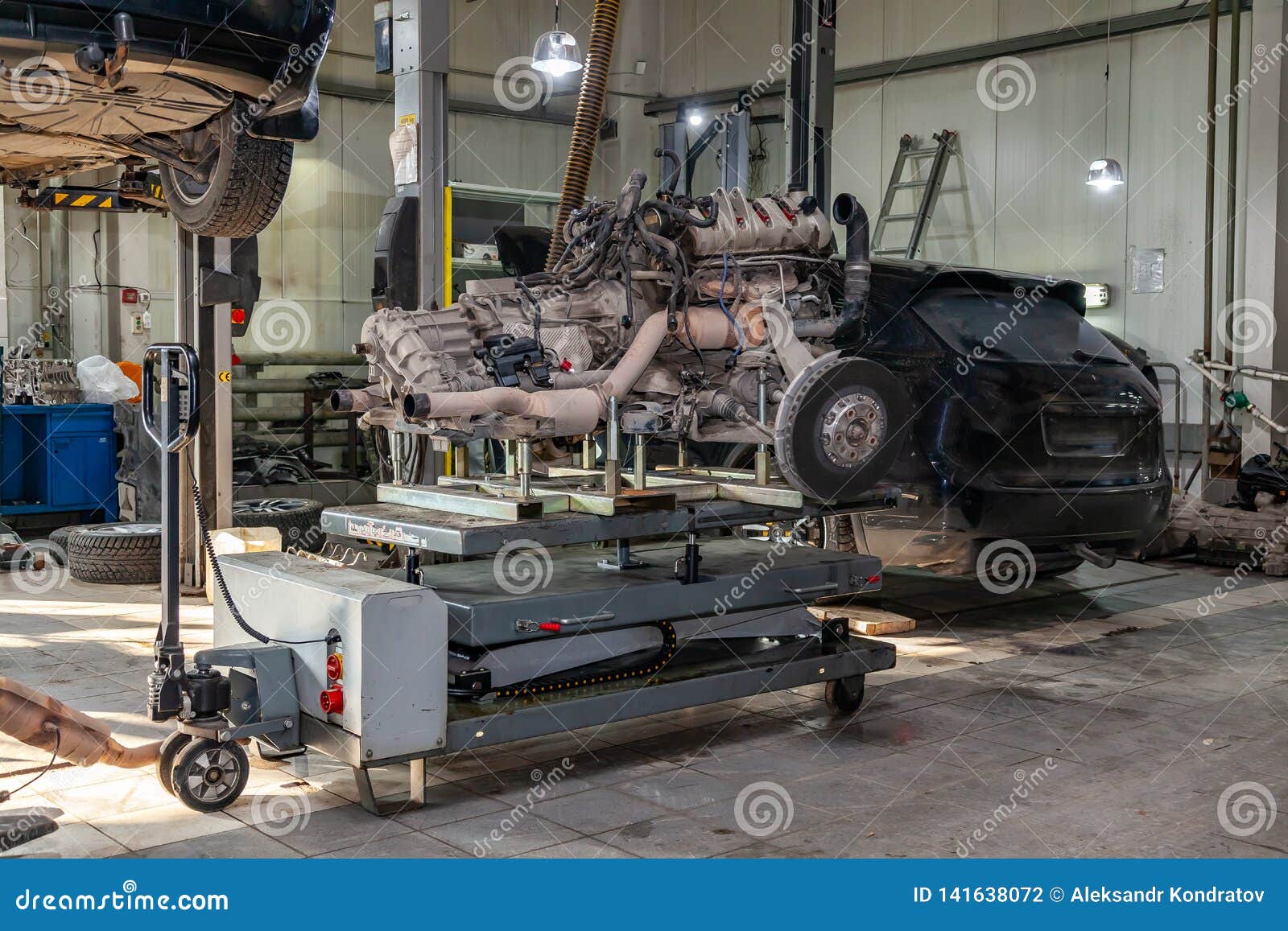 Replacement Engine Used on a Table Mounted for Installation on a Car