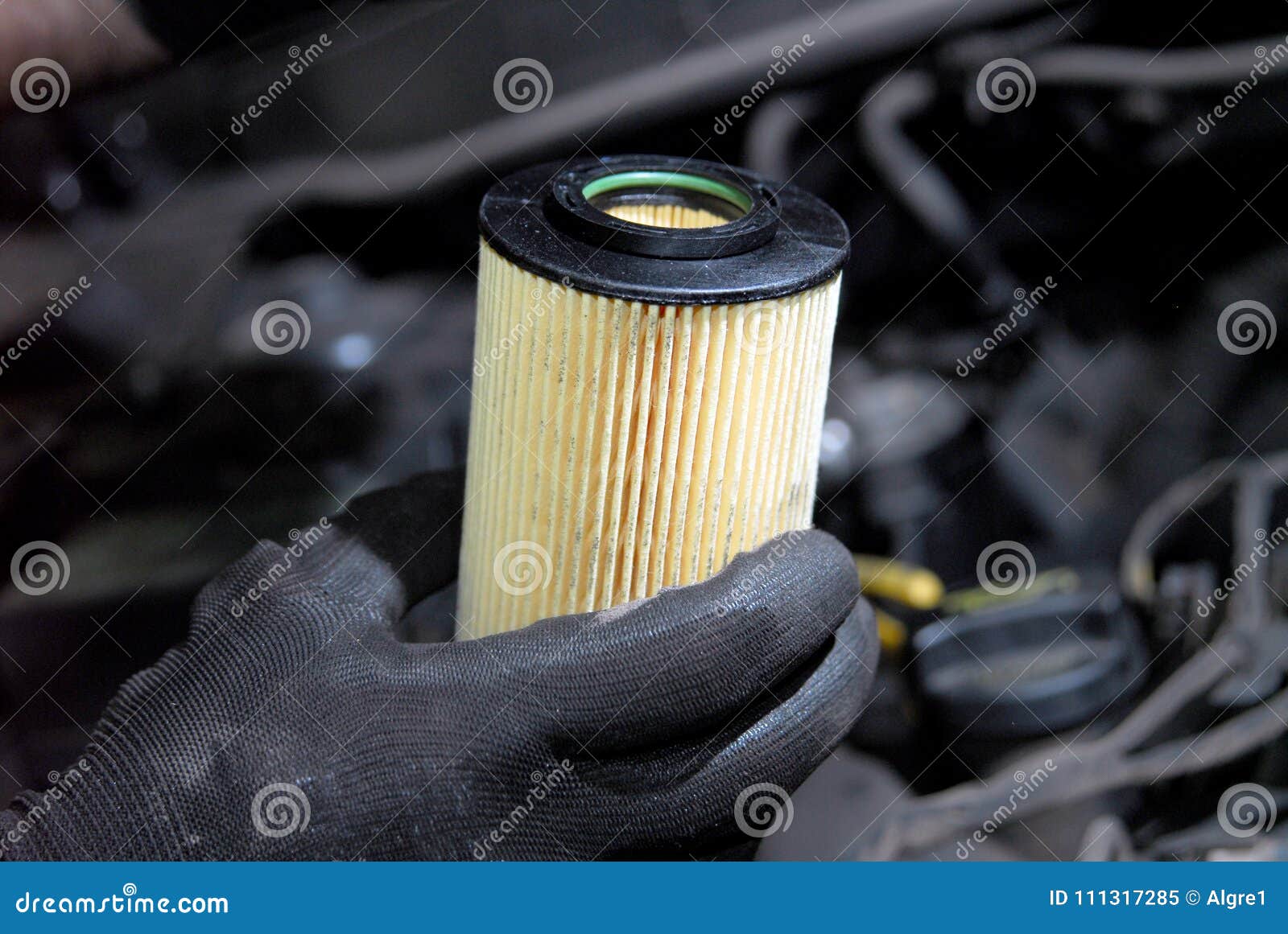 Replacement of oil filter stock image. Image of flow 111317285