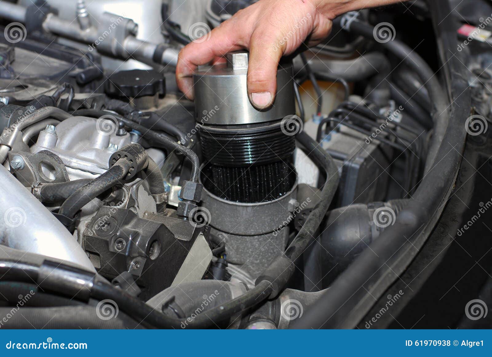 Replacement of oil filter stock photo. Image of engine 61970938