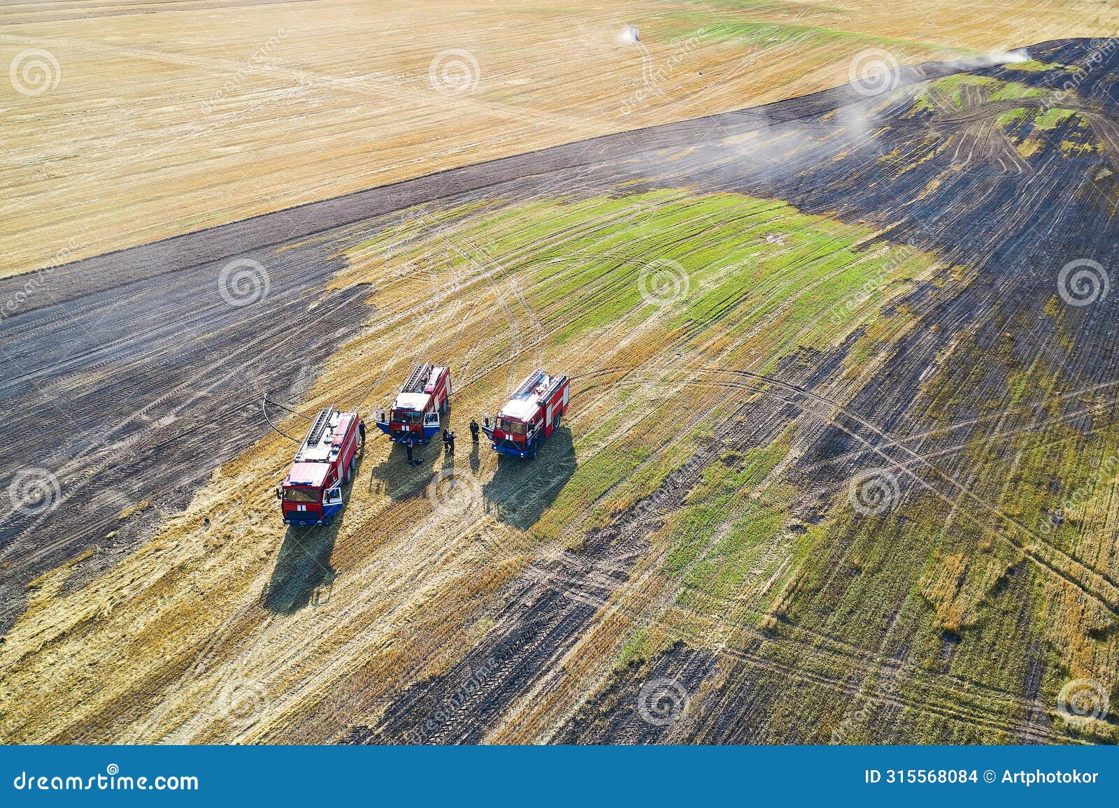 rescuers rest in the field after extinguishing a strong fire