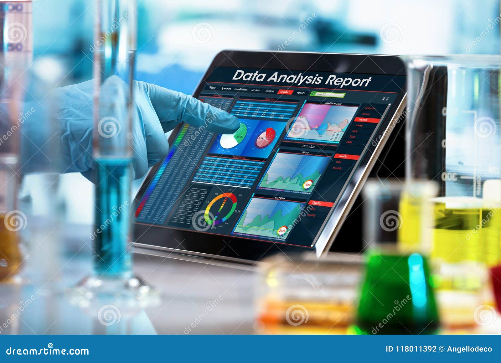 researcher working with data analysis report in digital tablet o