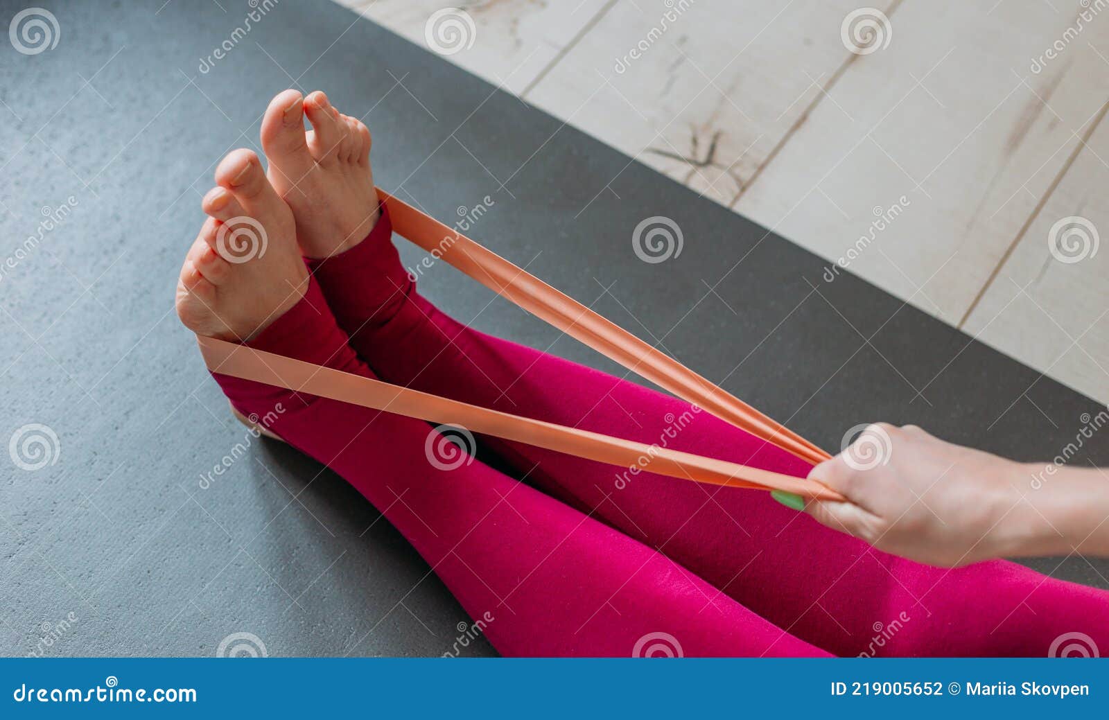 Resistance Band Exercise at Home. Woman Doing Pilates Workout Using Elastic  Strap Pulling with Arms for Shoulder Stock Photo - Image of fitness,  lifestyle: 219005652