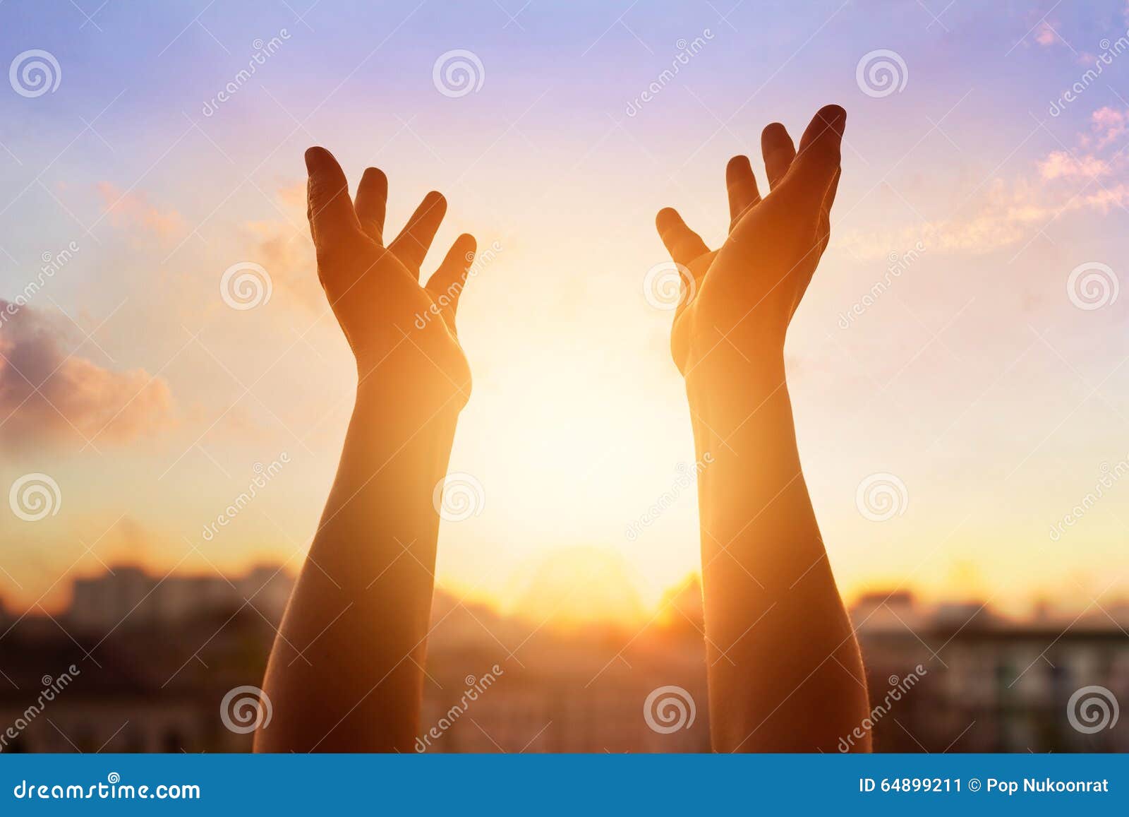 respect and pray on the sunset in city background