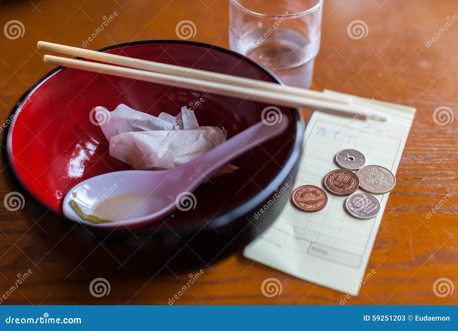 restaurant bill with coins