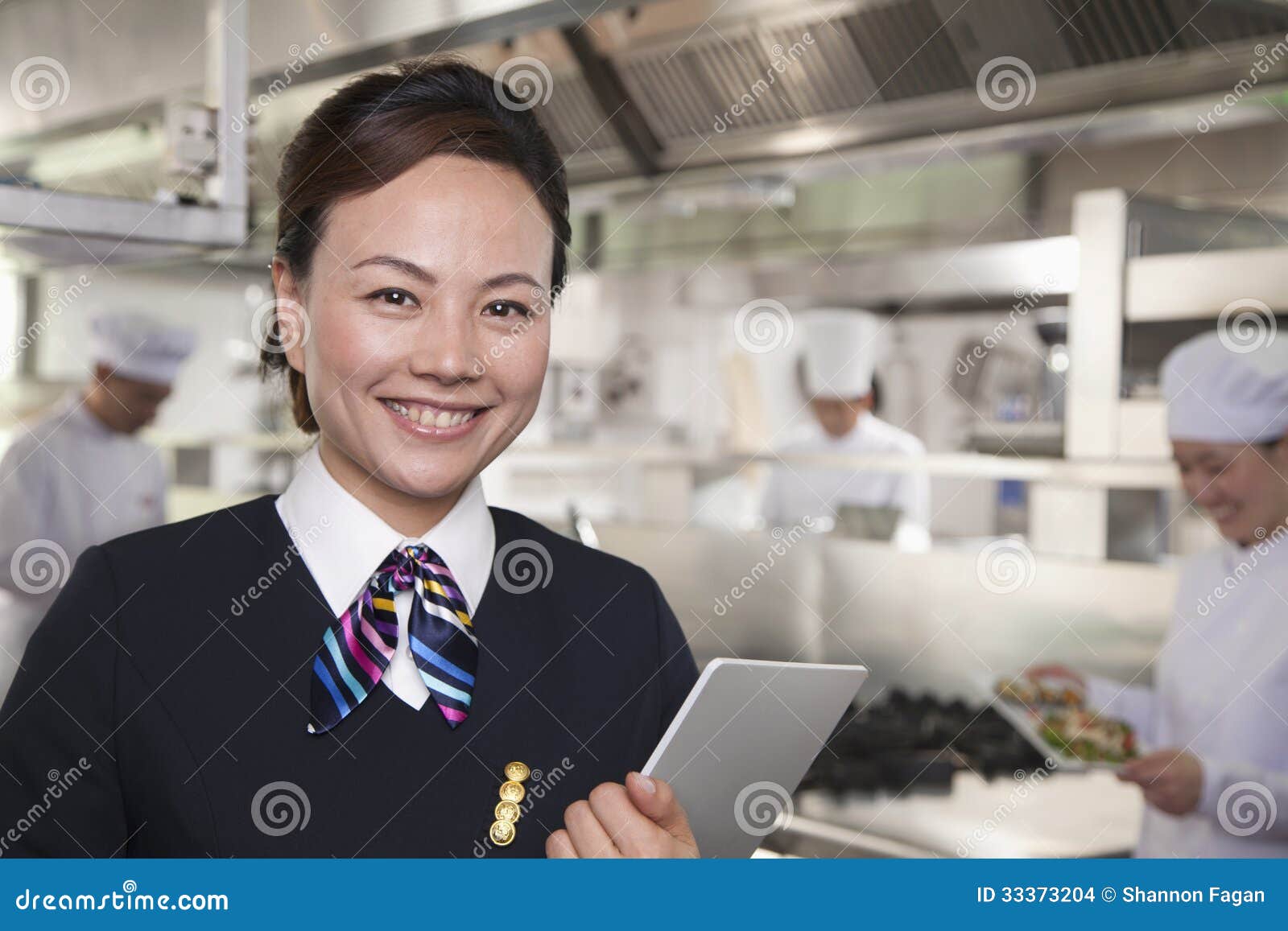 Restaurant Hostess in an Industrial Kitchen Stock Photo Image of