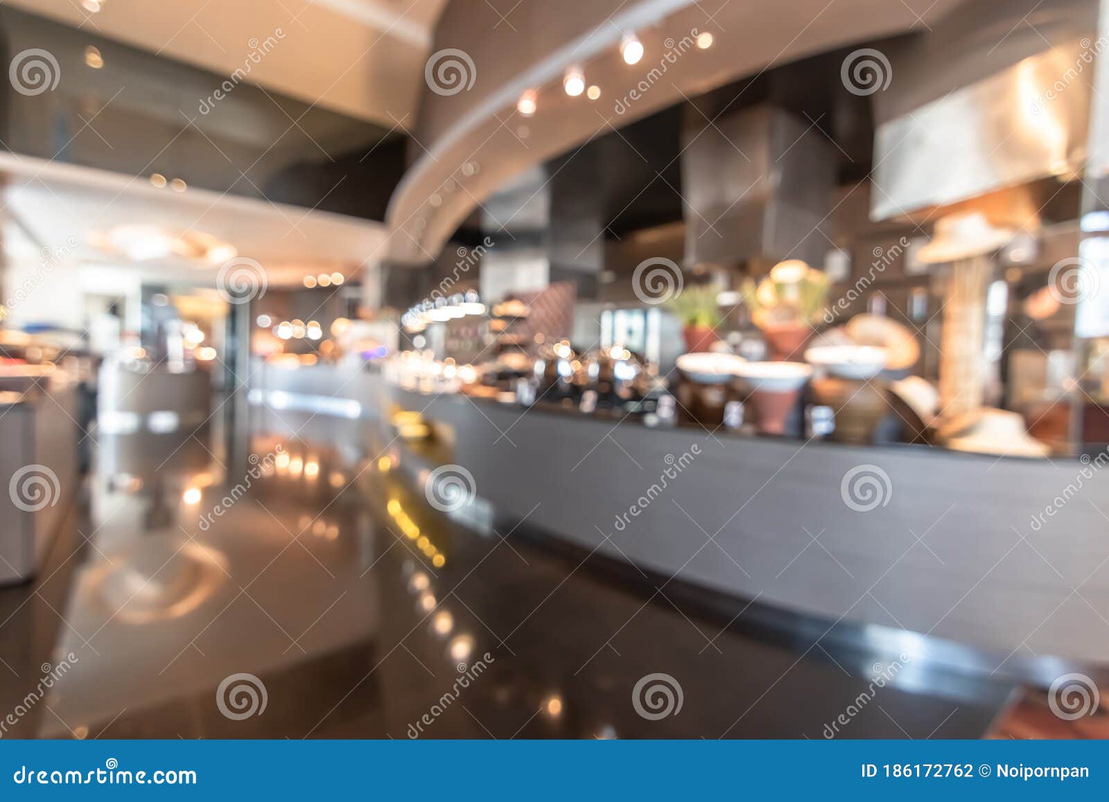 restaurant open kitchen blur background in luxury hotel showing chef cooking over blurry food counter for buffet catering service