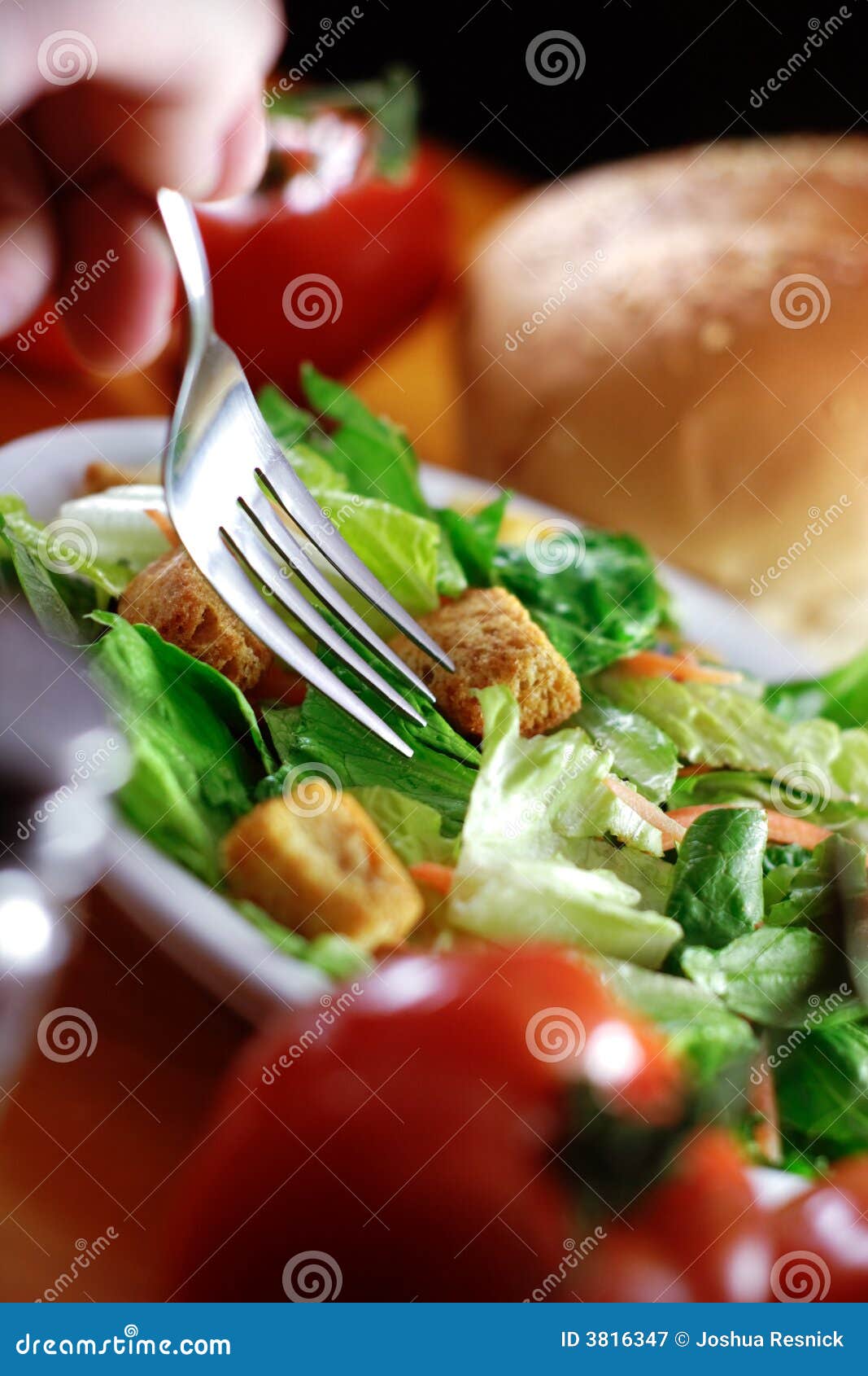 restaurant salad on wooden table.