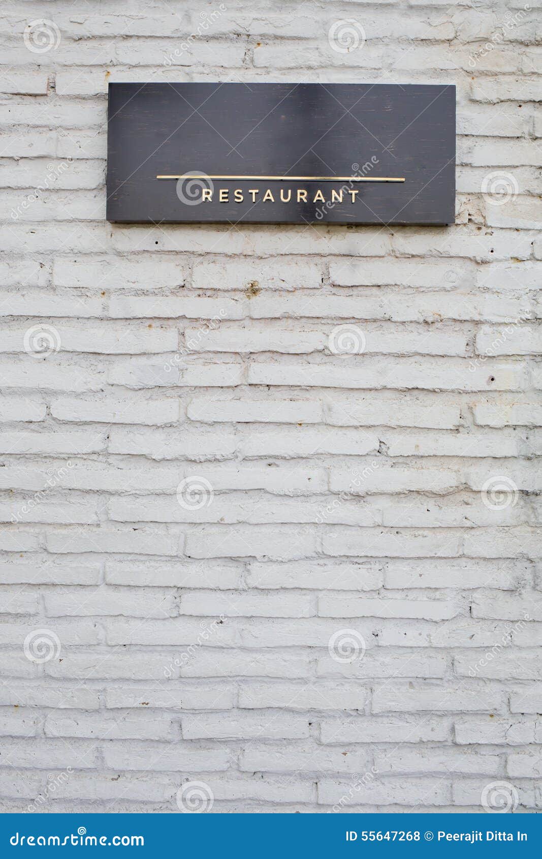 Restaurant Sign on Black Marble Board on White Brick Wall Stock Photo