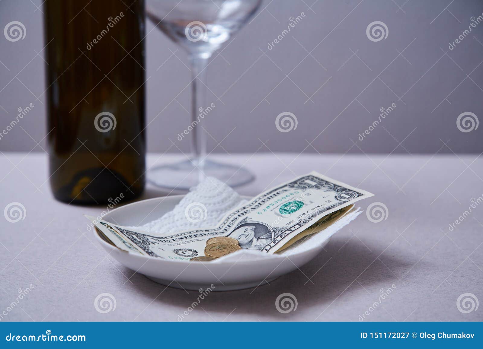 restaurant tips or gratuity. banknotes and coins on a plate