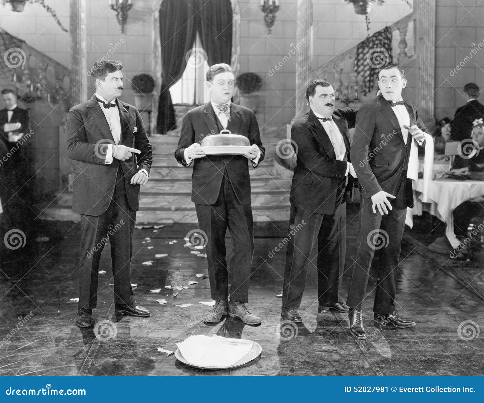 restaurant with two managers and two waiters and broken plates