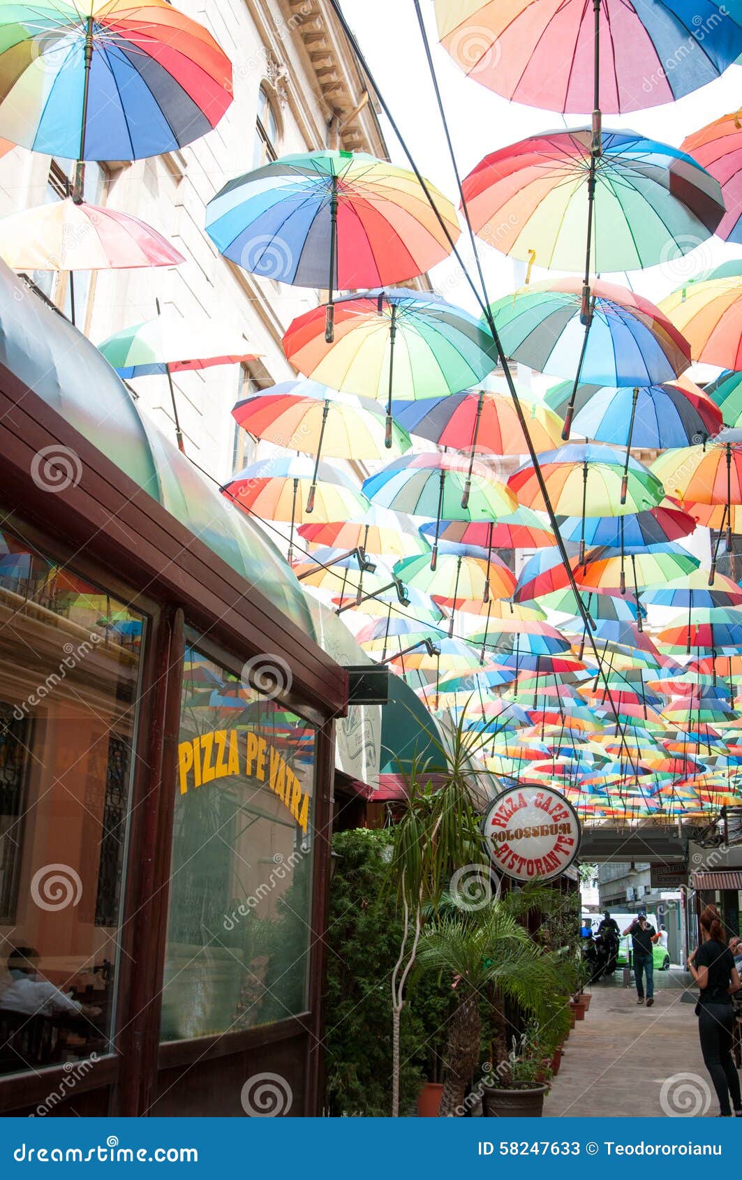 Restaurant with umbrellas editorial stock photo. Image of serving