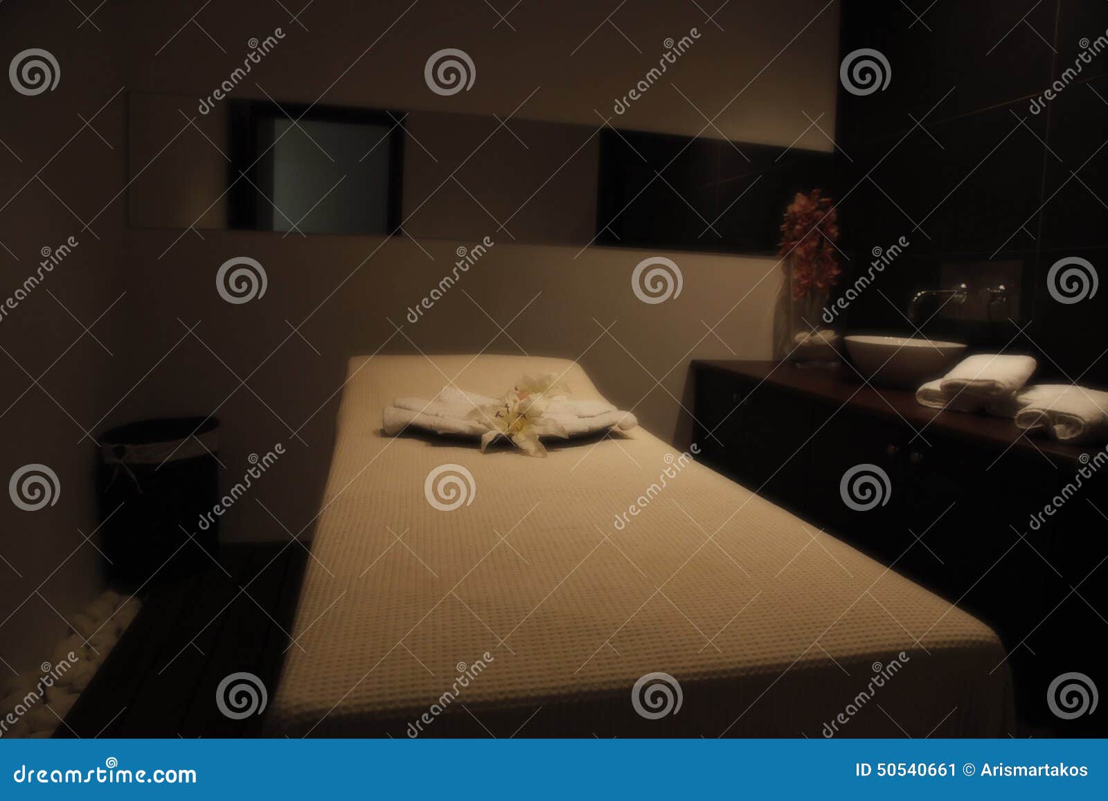 restful bed in massage room of a spa