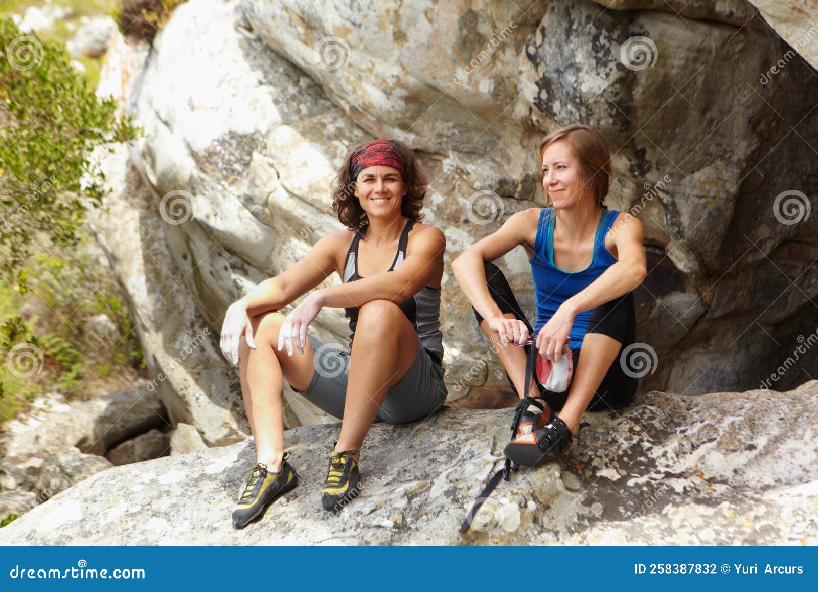 Resting before they Continue on. Two Rock Climbers Resting on a Rock