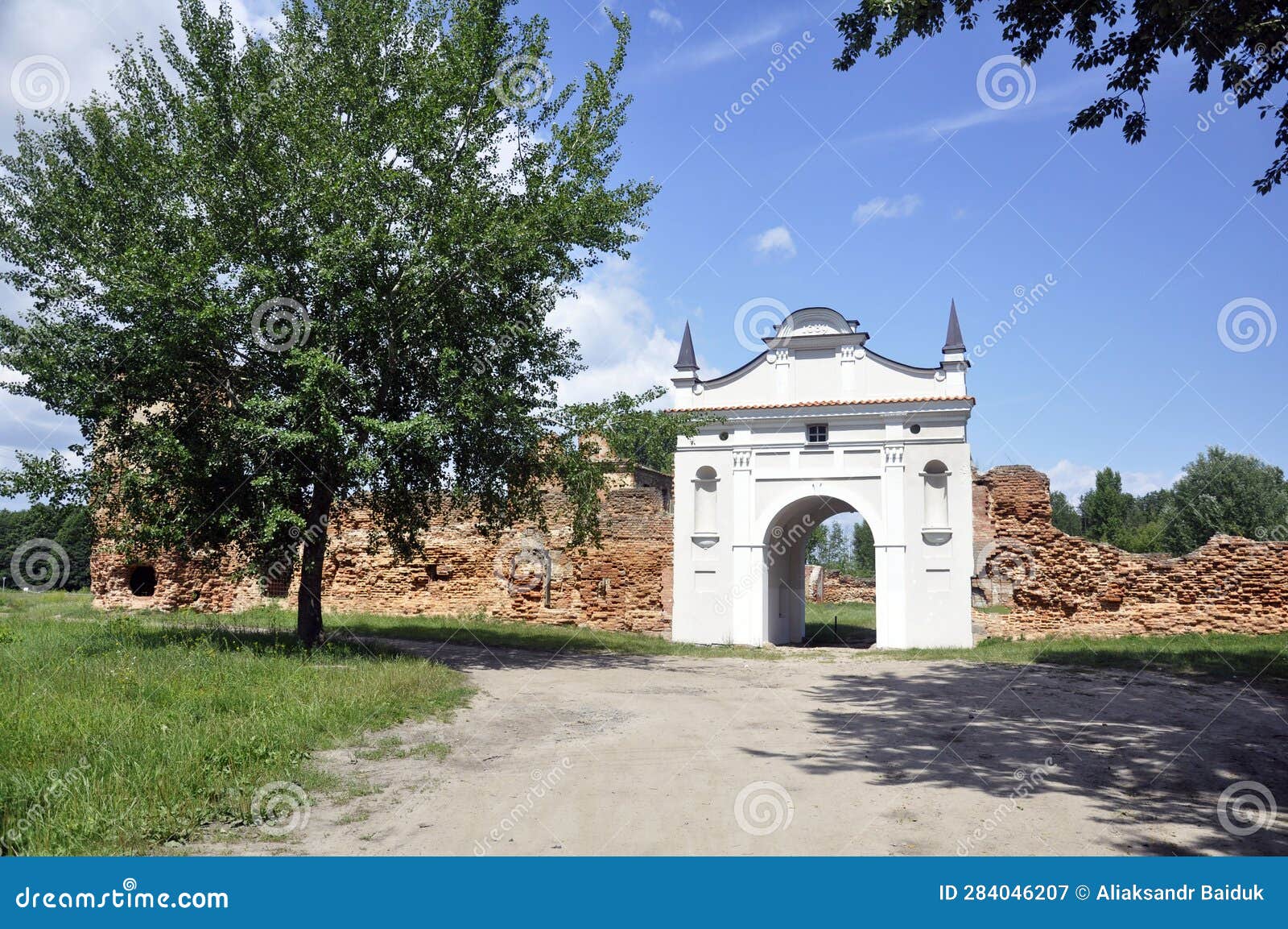 restored entrance gate and remains of the walls of the carthusian monastery of 1648-1666 in the town of bereza, belarus