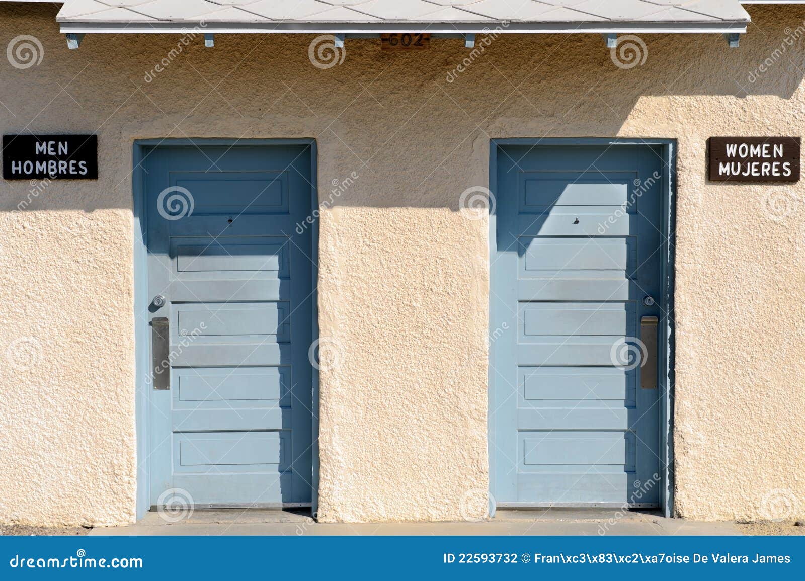 restrooms with english and spanish signs