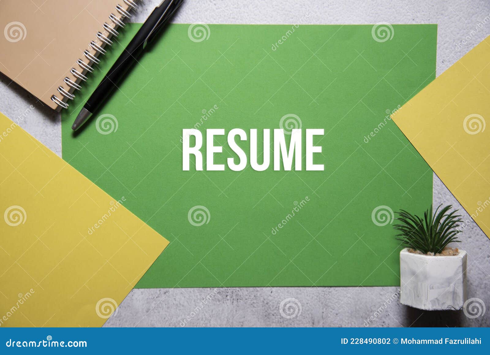 resume text on green and yellow background flat lay concept