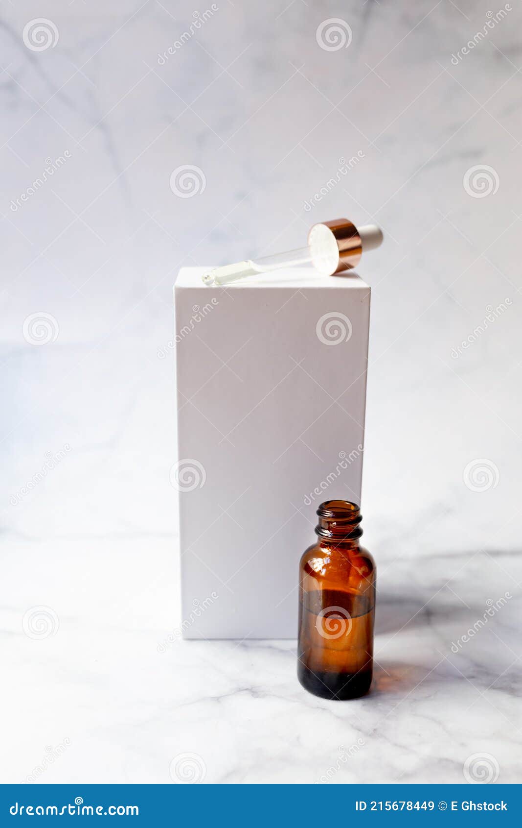 retinol oil serum oil bottle on  marble background. beauty care concept