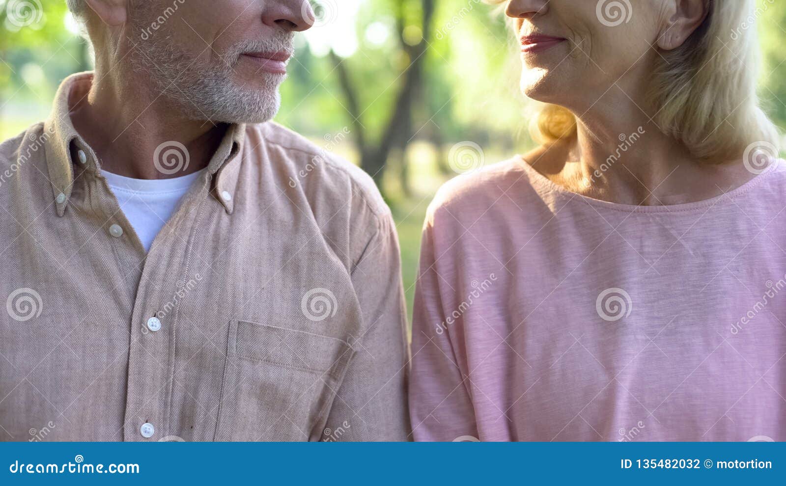 retired couple looking each other, romantic date outdoor, relation closeness