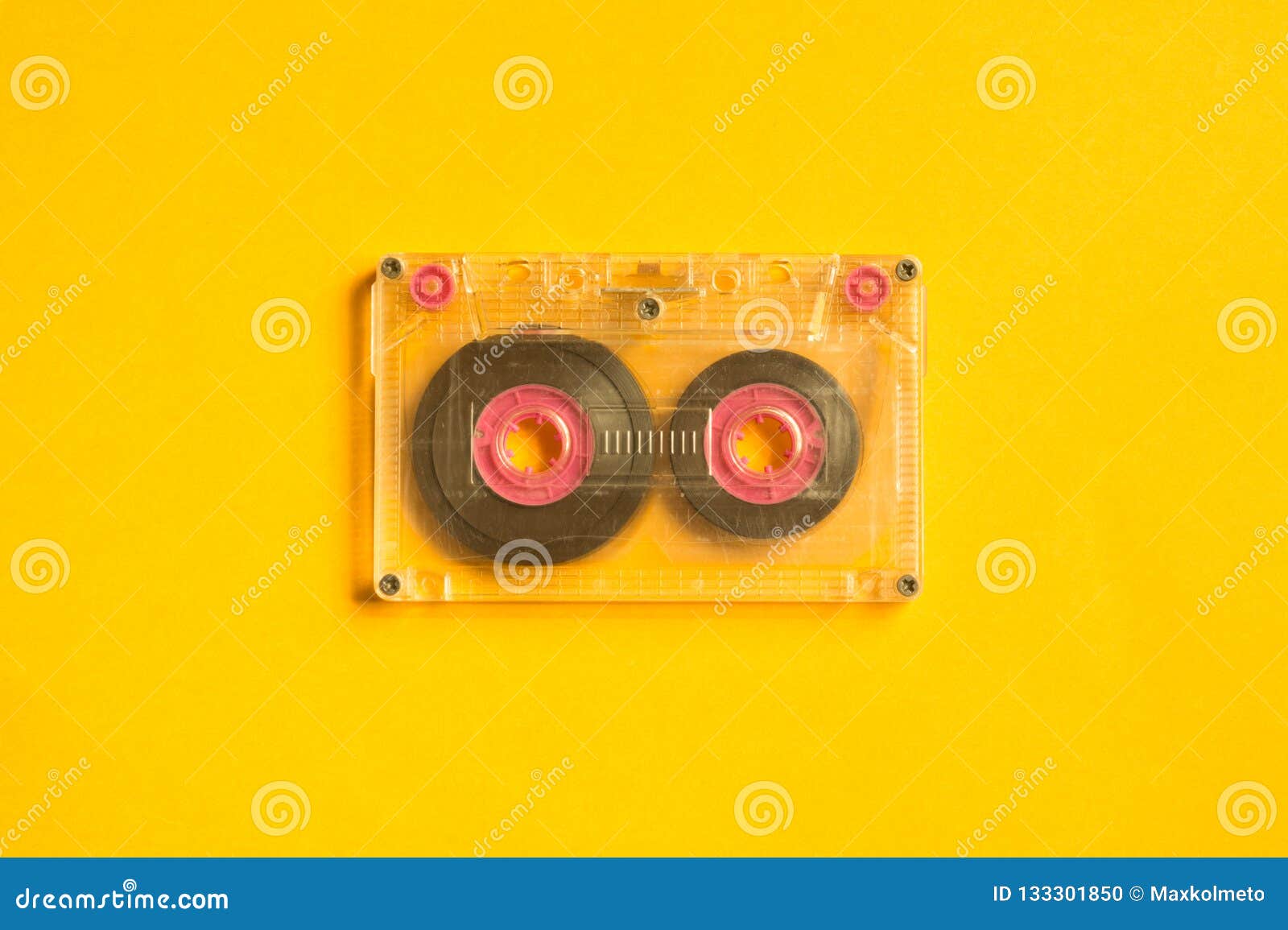 Retro Cassette Tape on the Yellow Background. Copy Space Stock Photo
