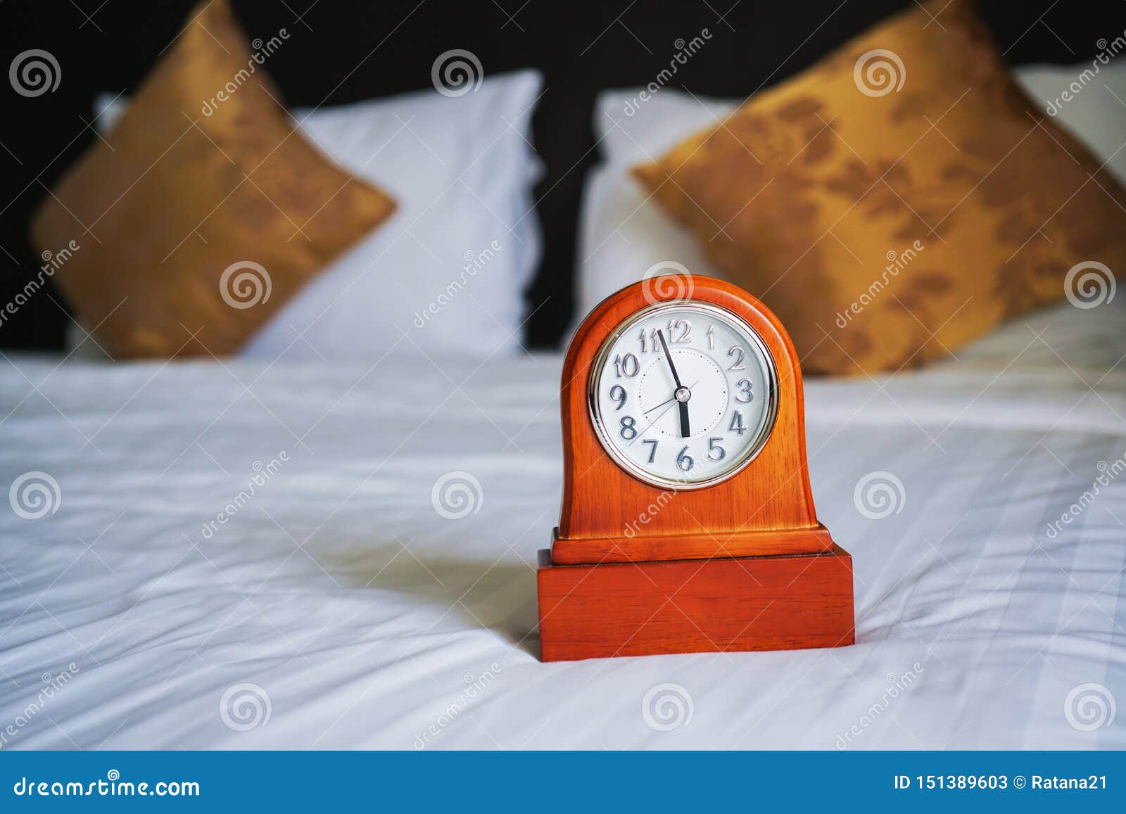 Retro Clock on White Bed with Blurred Pillows Stock Image Image of