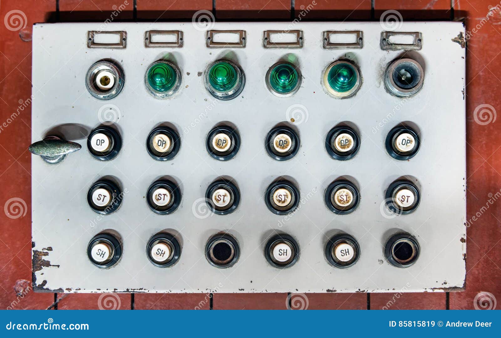 retro control panel with buttons, colored lights and switches