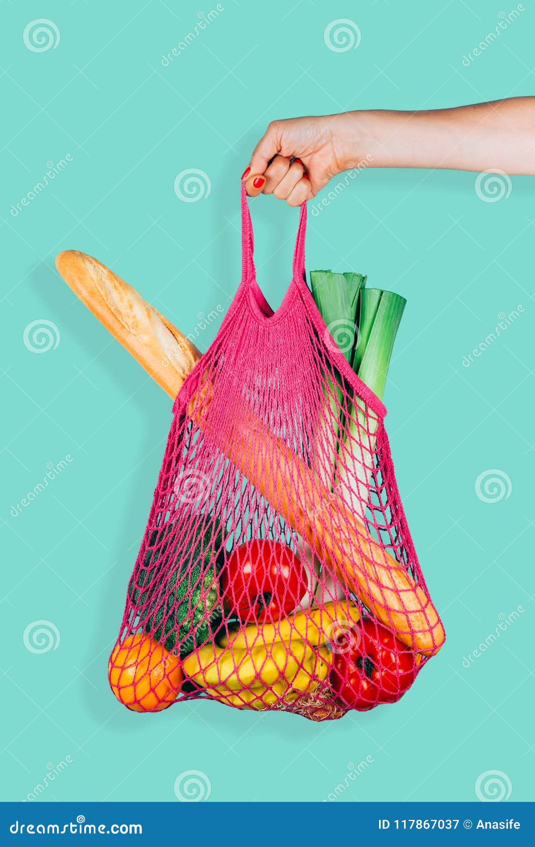 retro and ecological string shopping bag in woman hand