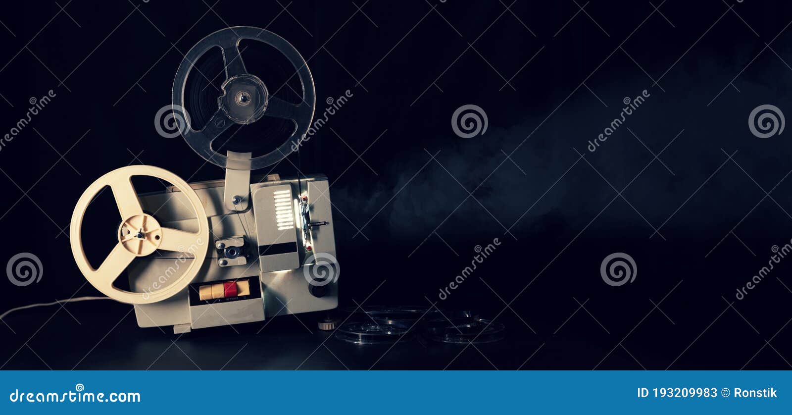 Retro Reel 8mm Movie Film Projector Working In Dark Room