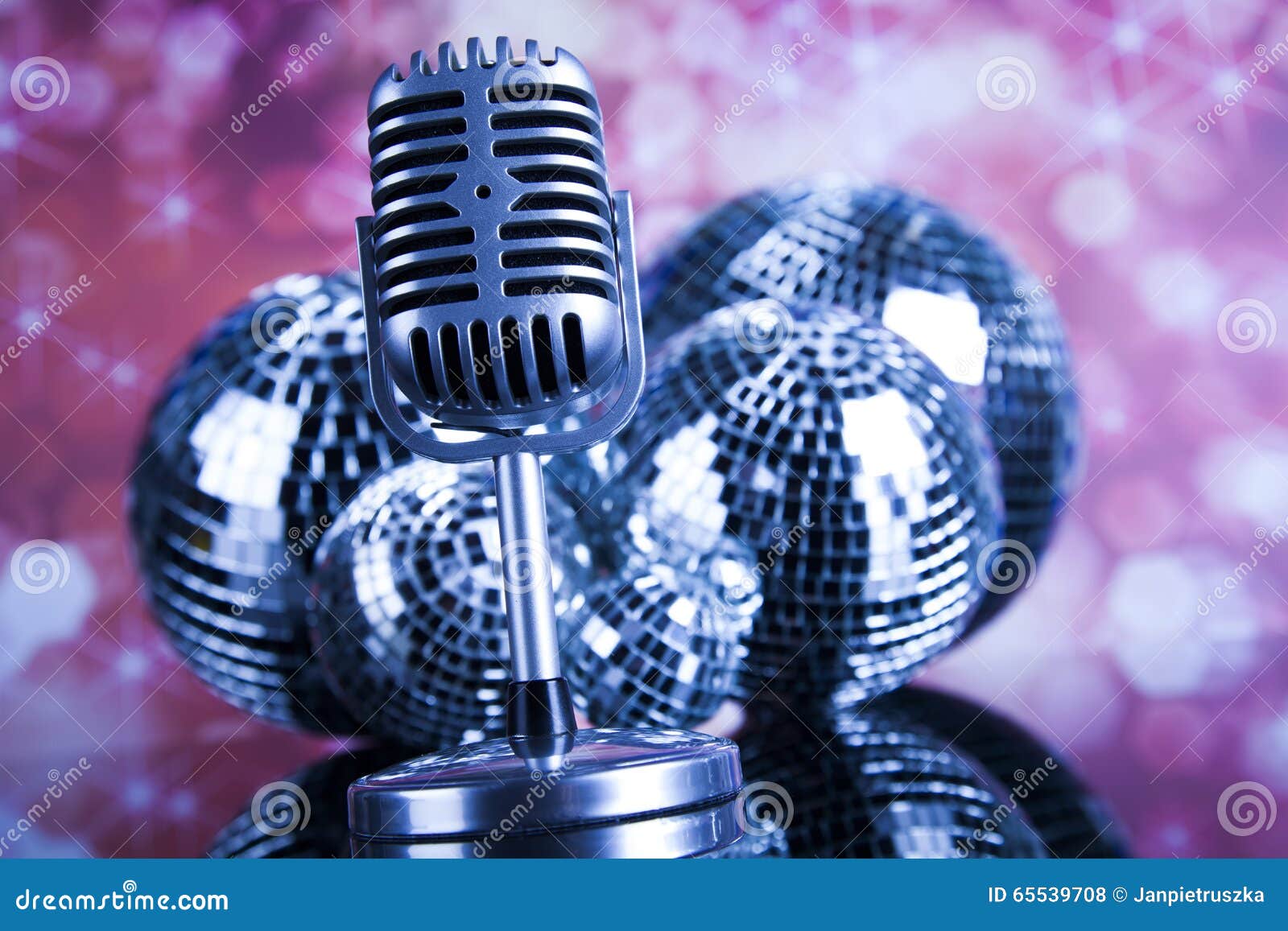 Retro Style Microphone on Sound Waves and Disco Balls Stock Photo