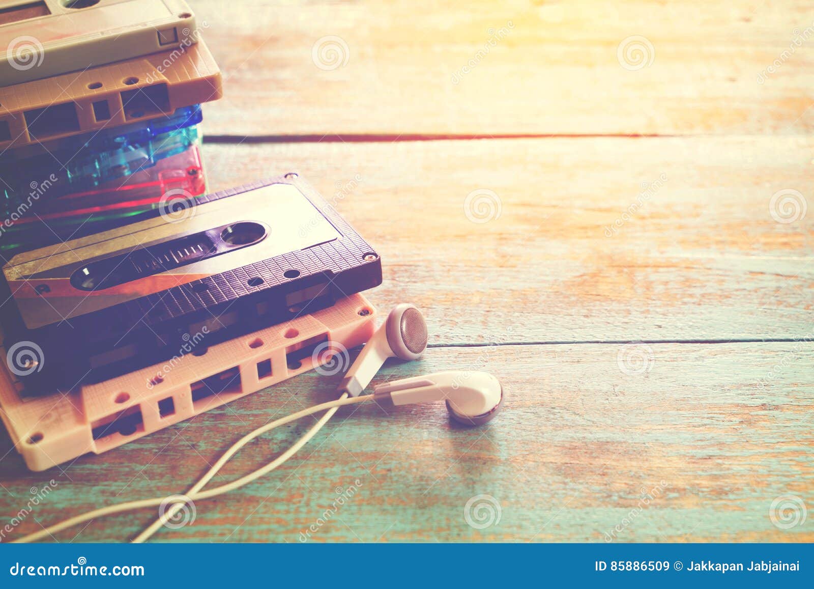 retro tape cassette with earphone on wood table