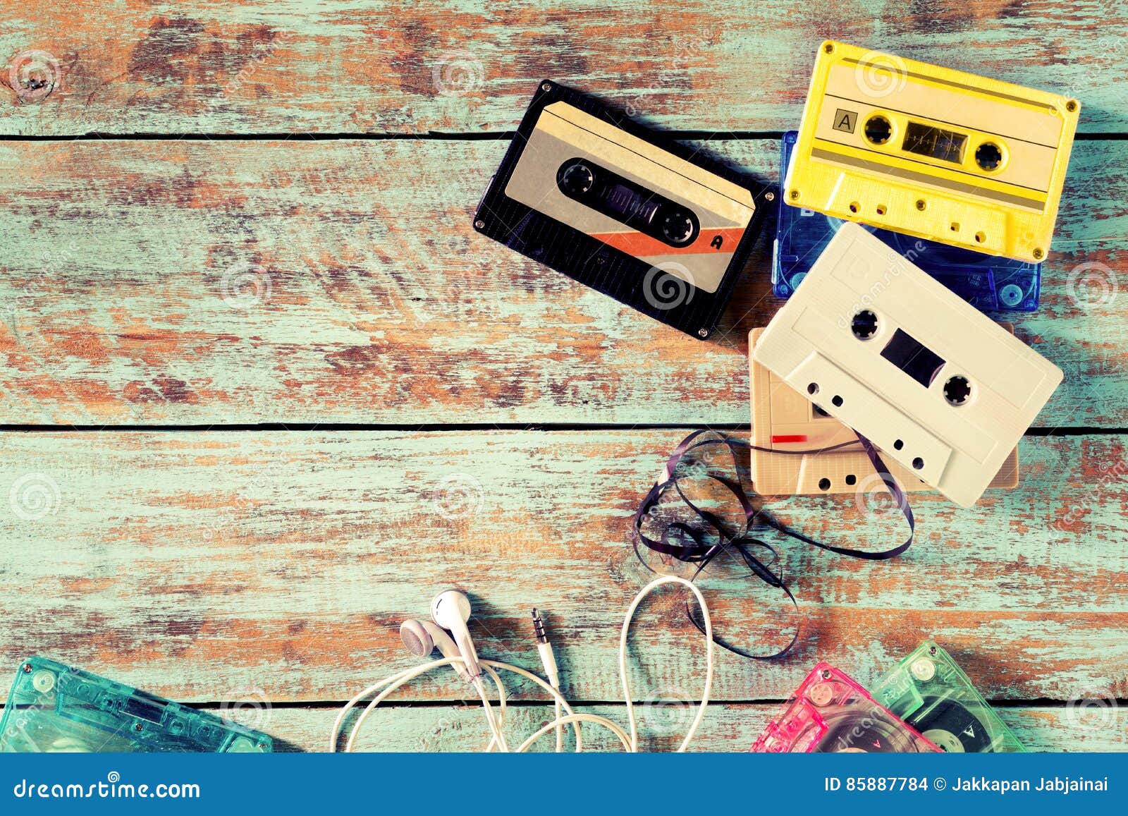 retro tape cassette with earphone on wood table