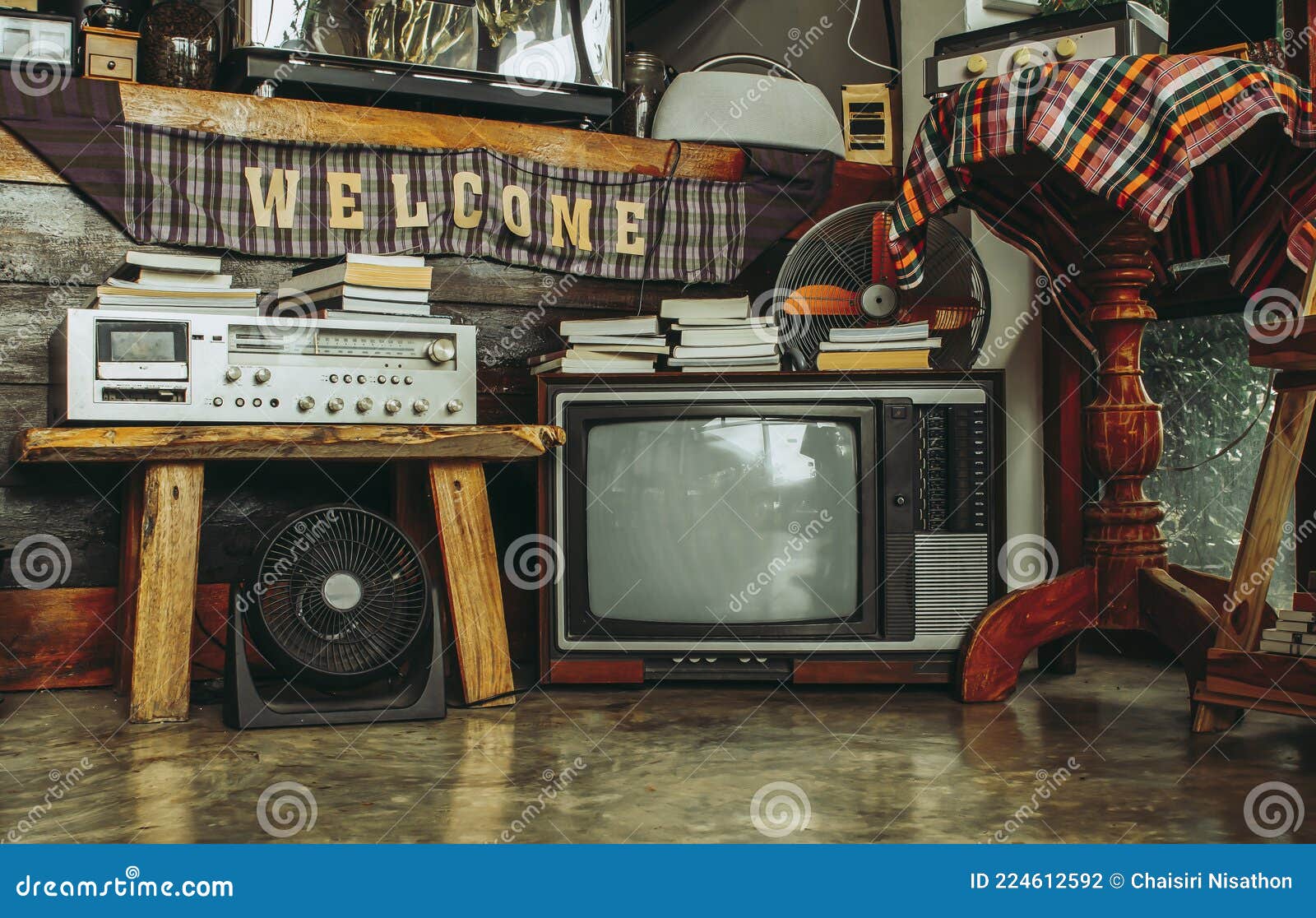 Retro Televisions and Radio Pile on Floor in Old Room. Stock Photo