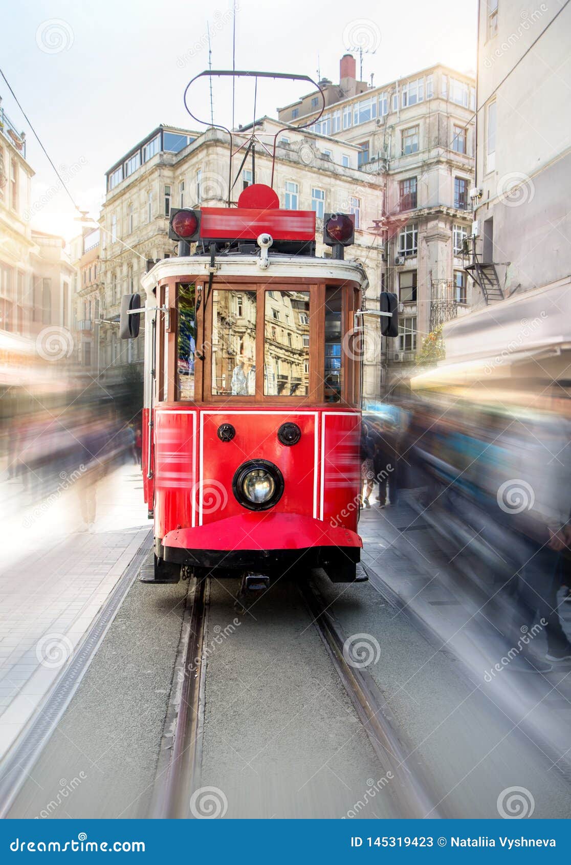 retro tram on taksim istiklal street in istanbul, turkey in a summer day