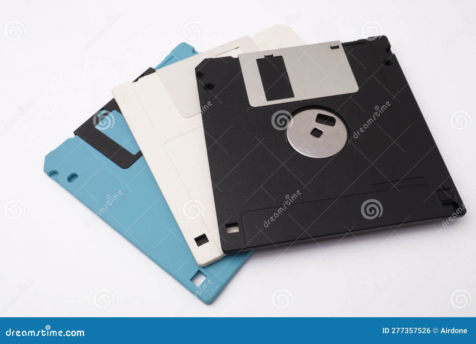 retro vintage floppy disk diskettes on white, old time computer storage equipment hardware