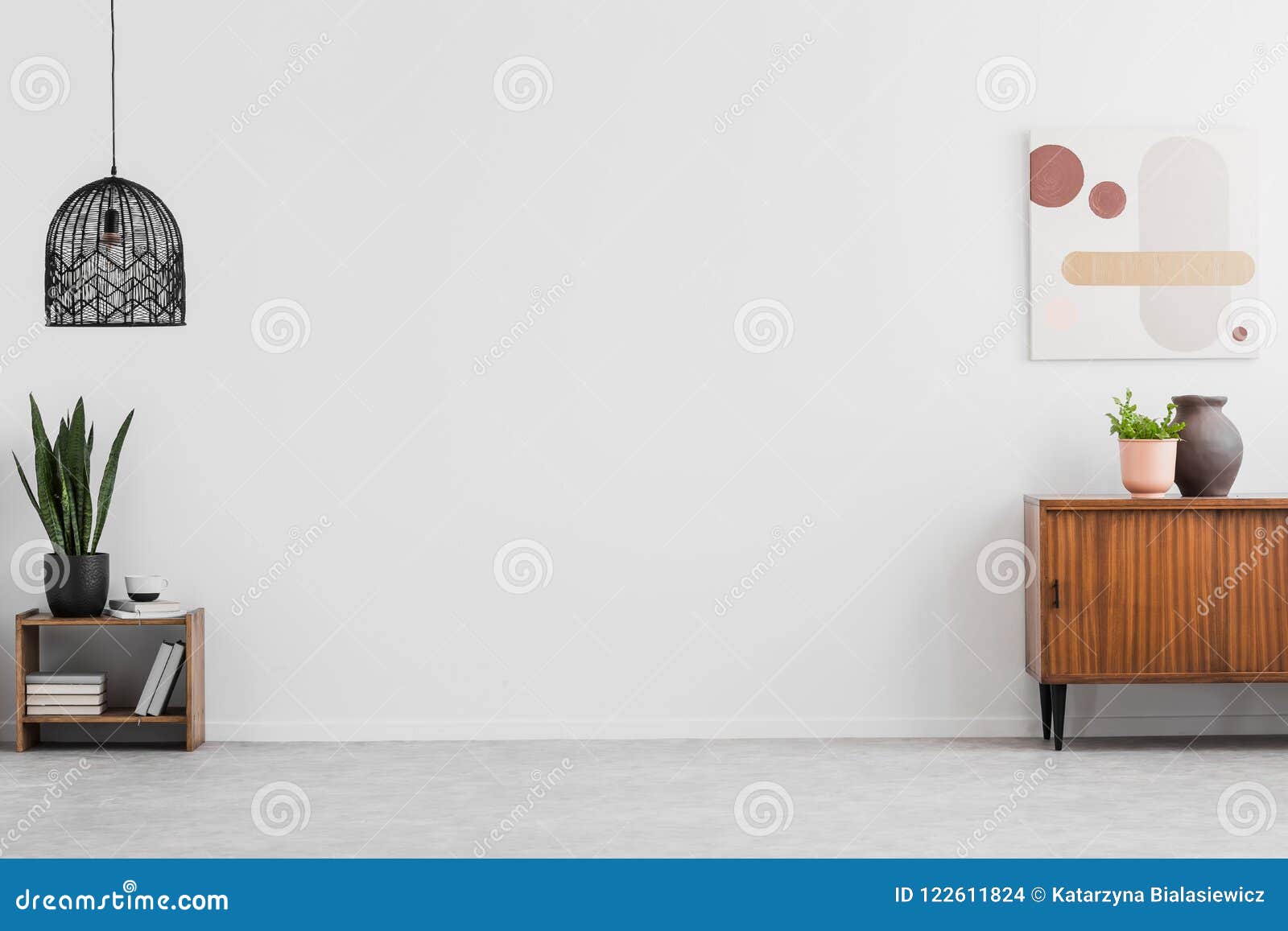 retro, wooden cabinet and a painting in an empty living room interior with white walls and copy space place for a sofa. real photo