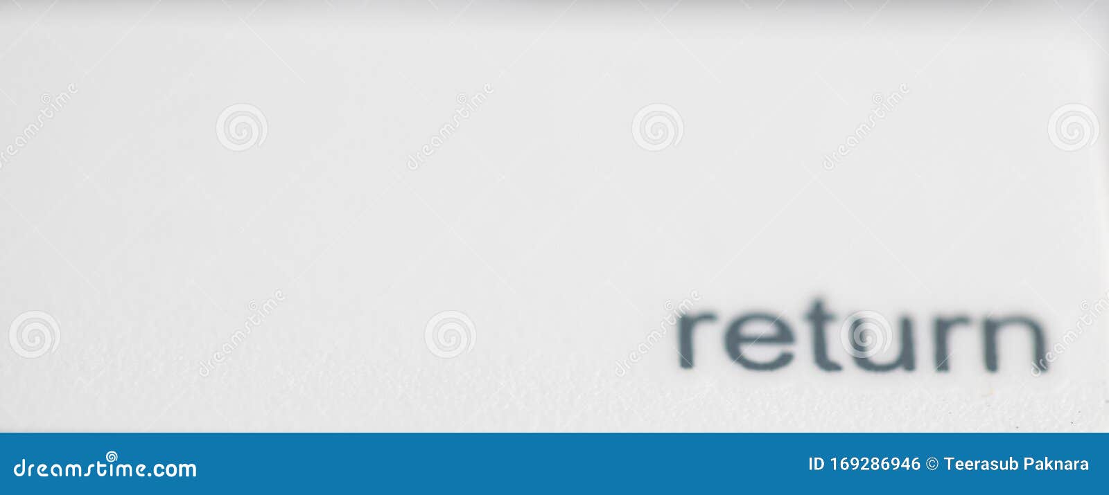 The Return Button On A Computer Keyboard Colored Blue, With The