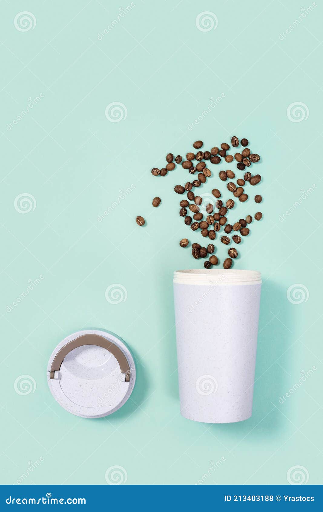 reusable eco coffee cup with roasted coffee beans