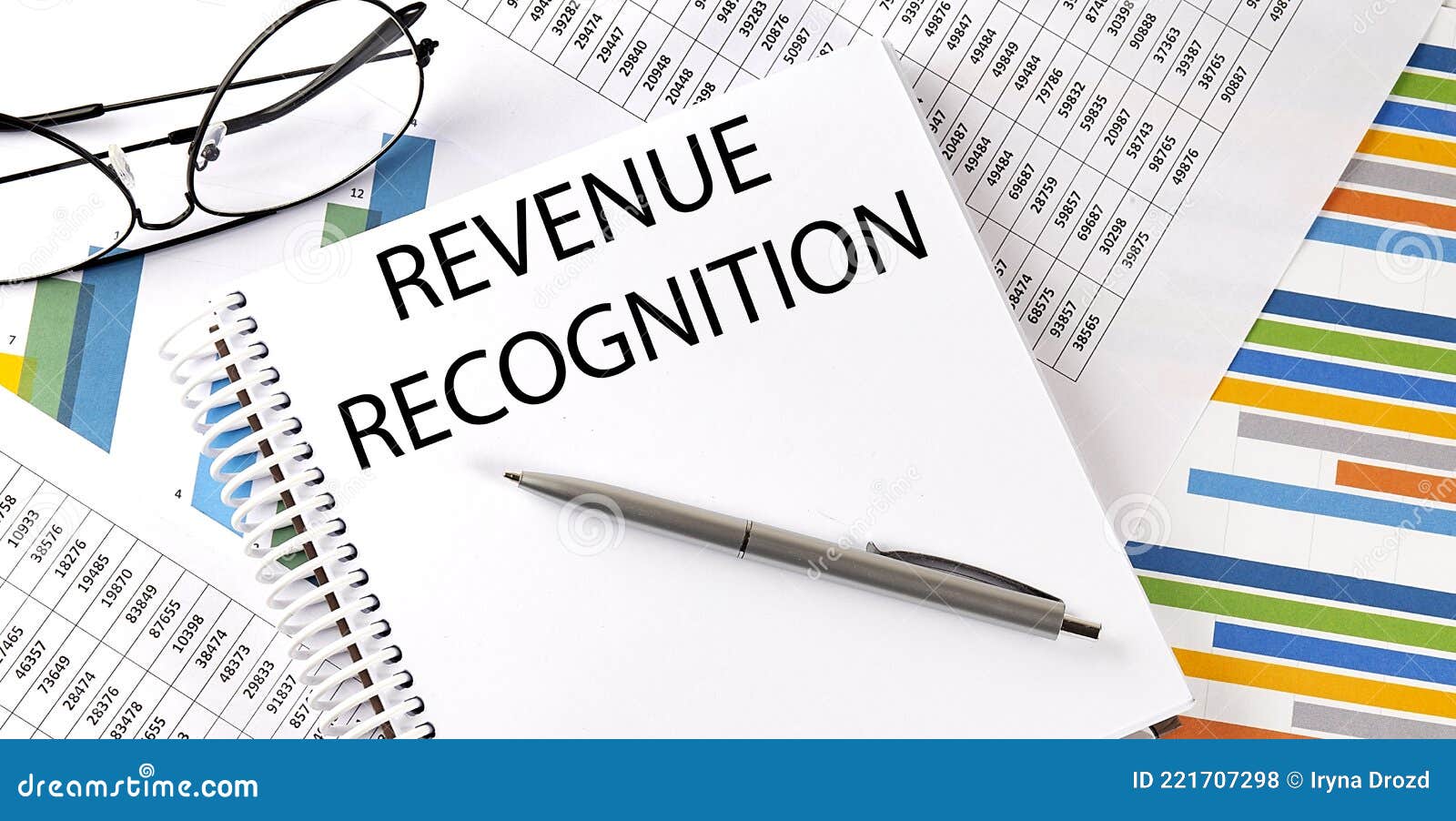 revenue-recognition-pen-and-glasses-on-the-chart-business-concept