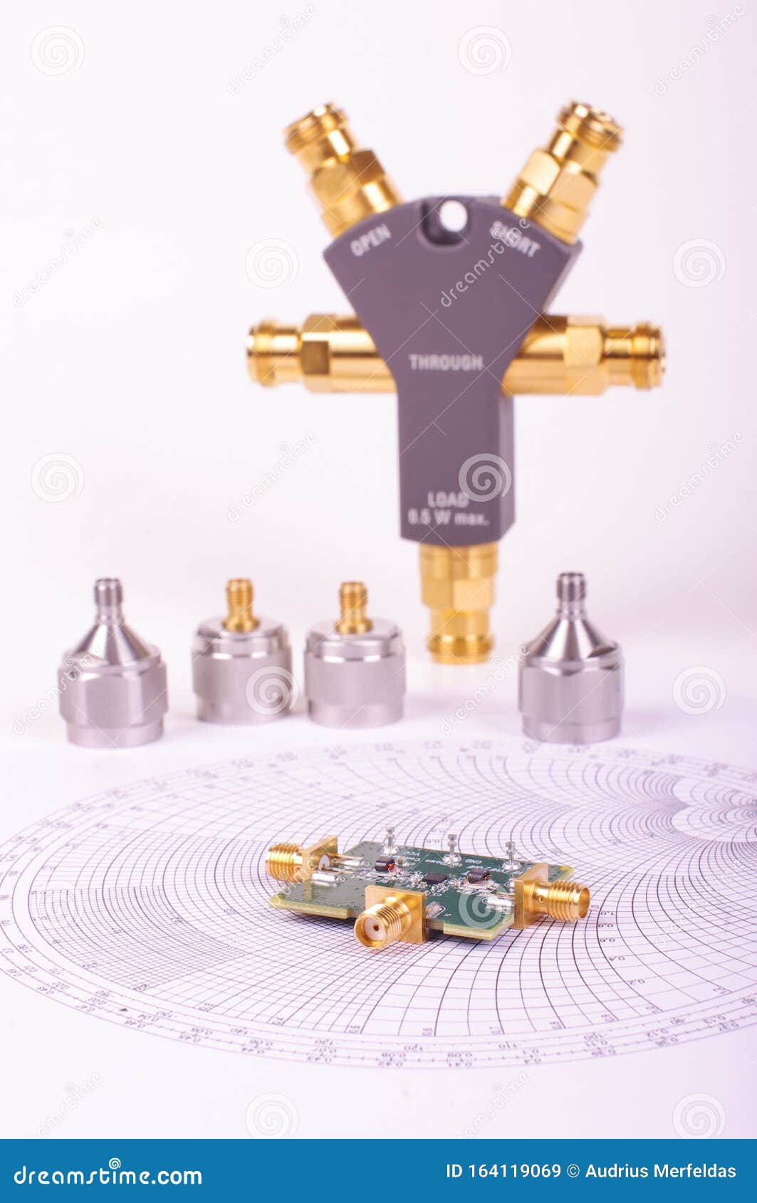 RF Mixer Electronics PCB in Front of Smith Chart and Other Microwave