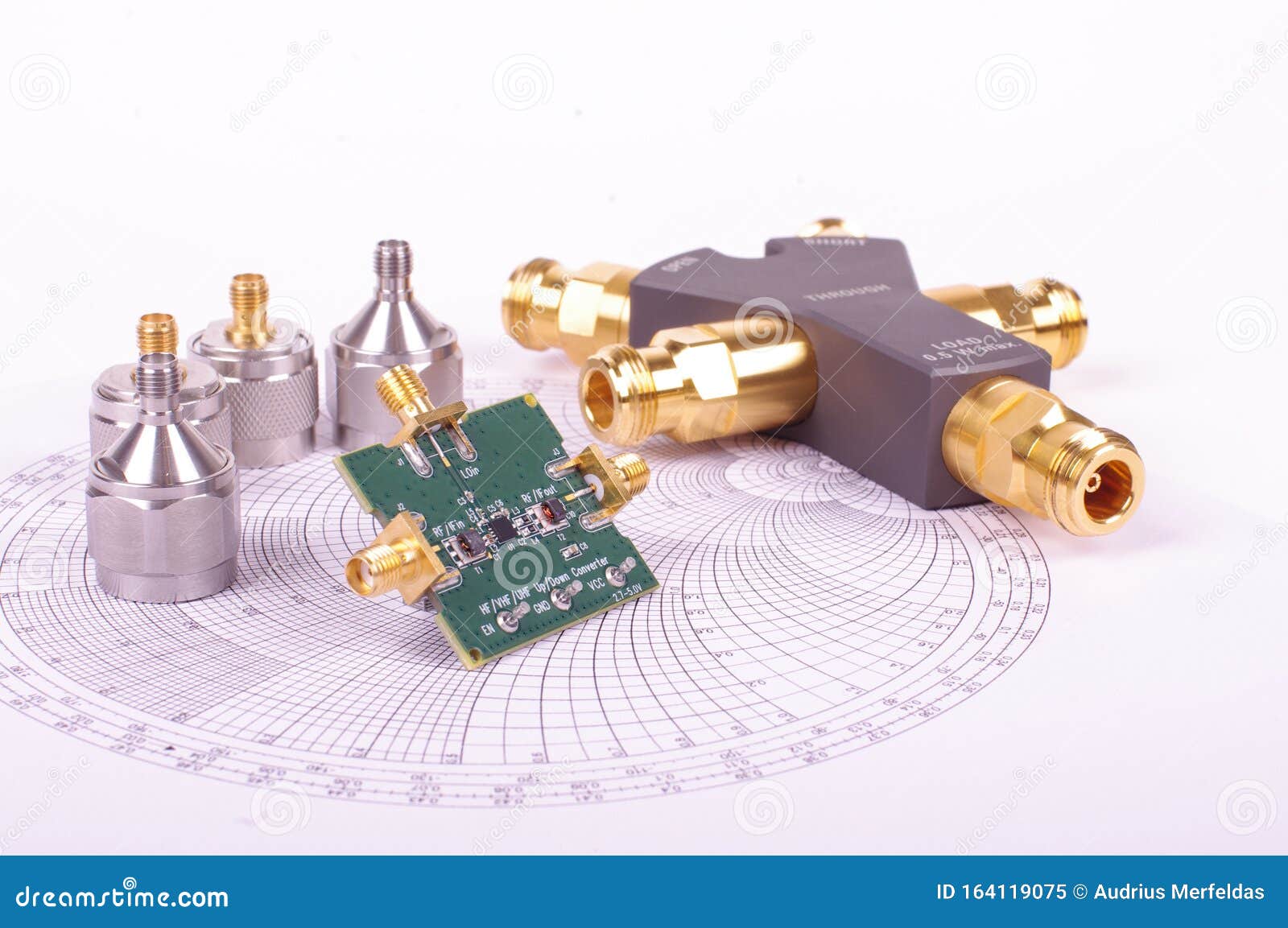 RF Mixer Electronics PCB in Front of Smith Chart and Other Microwave